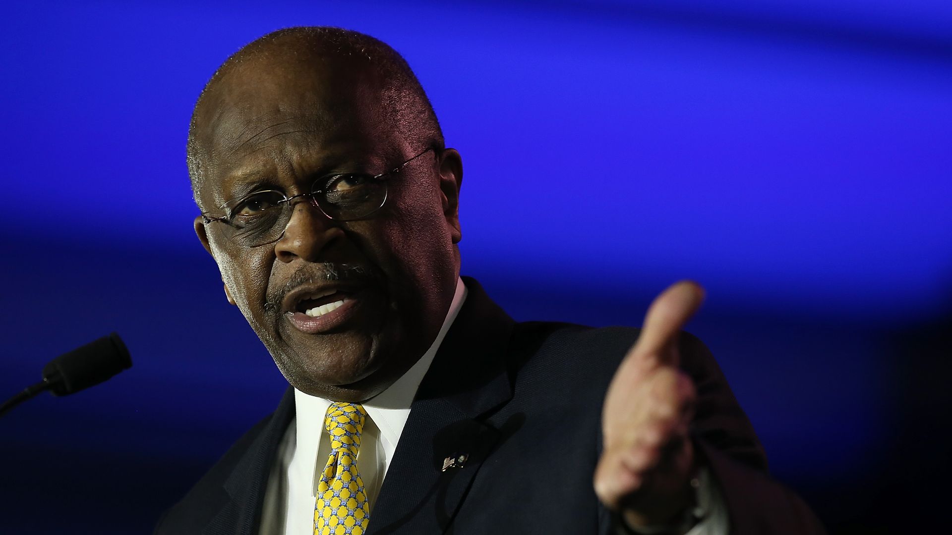 Herman Cain giving a speech
