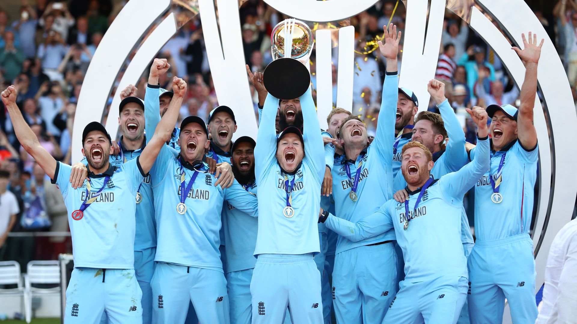 England holds up the trophy after winning the Cricket World Cup