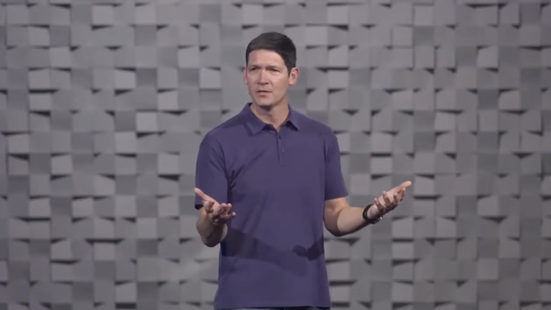 A pastor in a purple polo