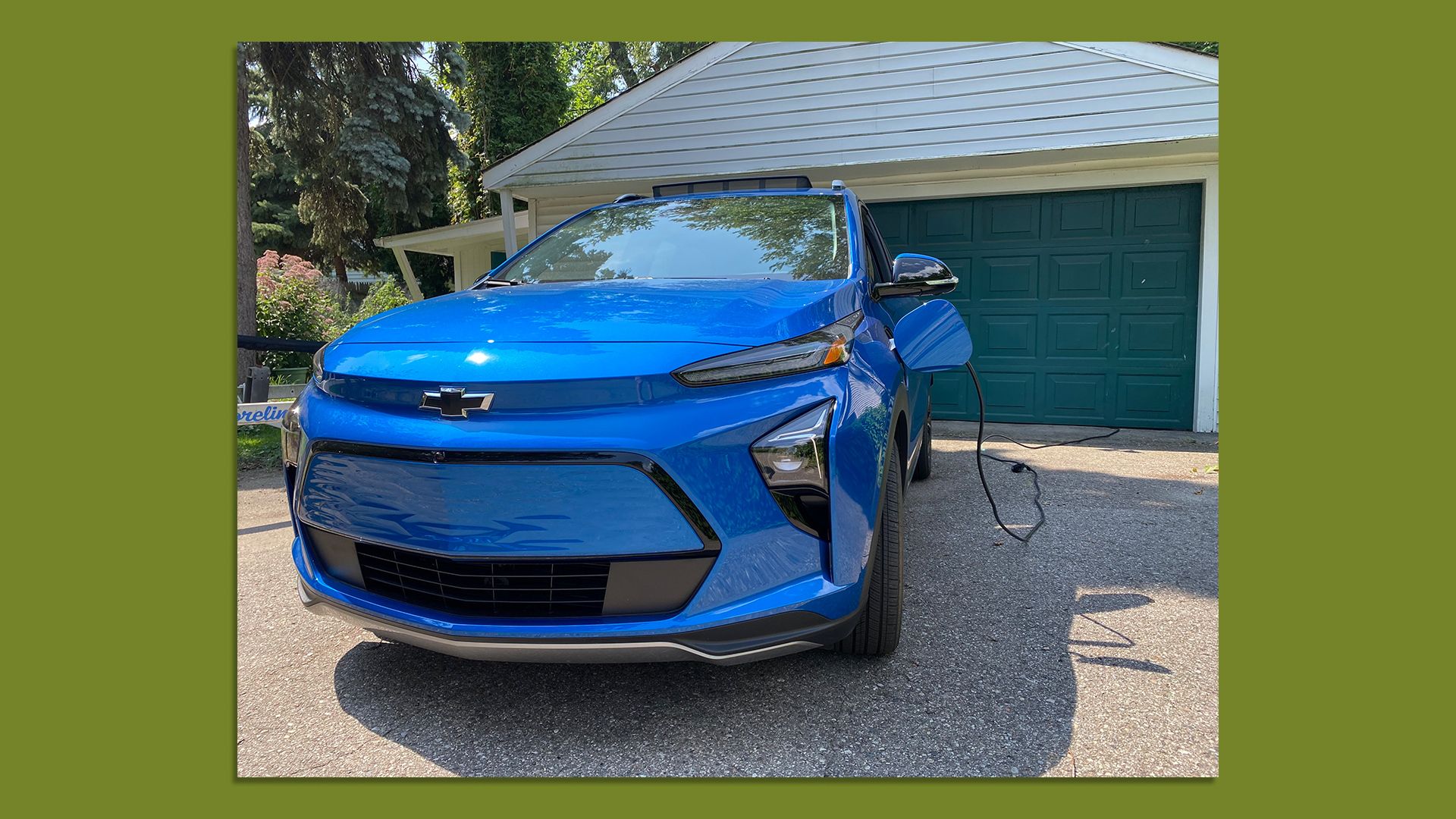 Image of a 2022 Chevrolet Bolt EUV parked outside my garage while charging