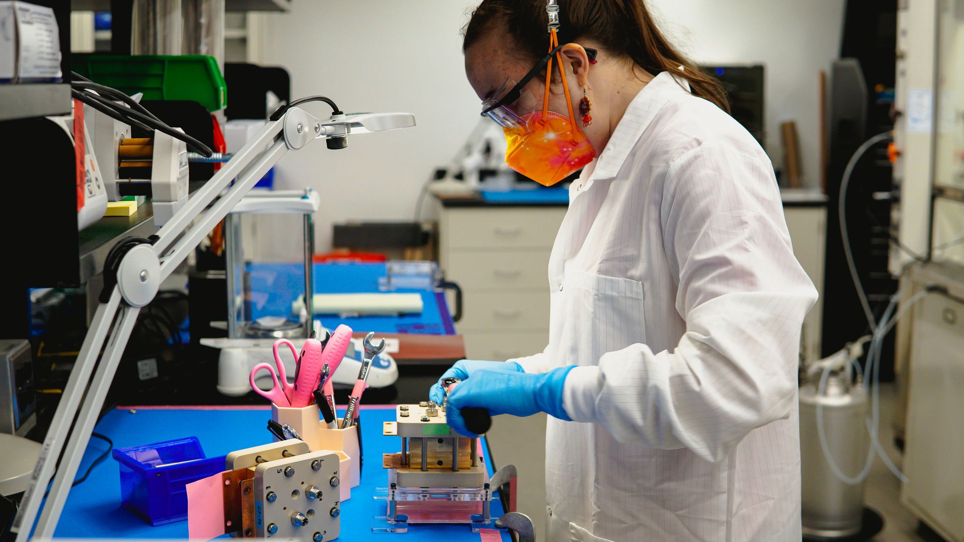 A researcher works on equipment that makes up an electrolyzer for green hydrogen company Electric Hydrogen