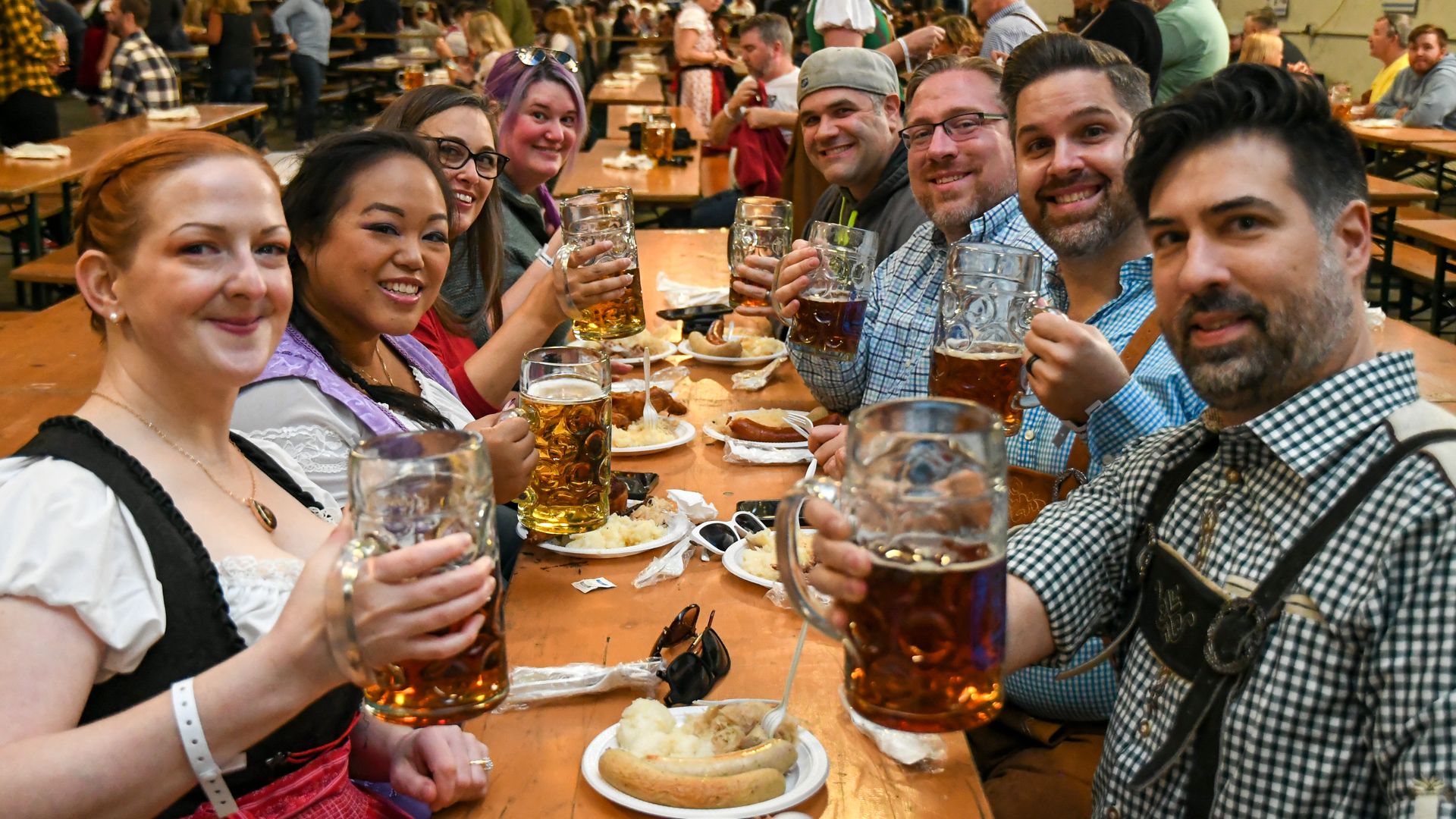 People drinking beer at an Oktoberfest event