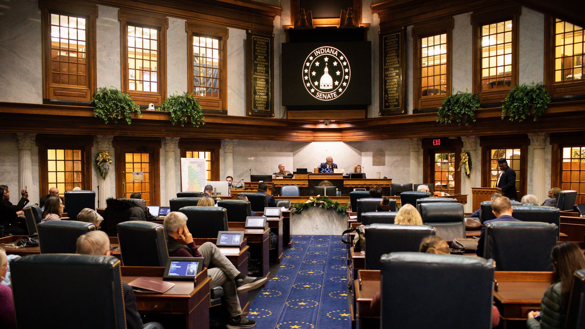 State senators listen to testimony at the Indiana Statehouse in Indianapolis on Dec. 8.