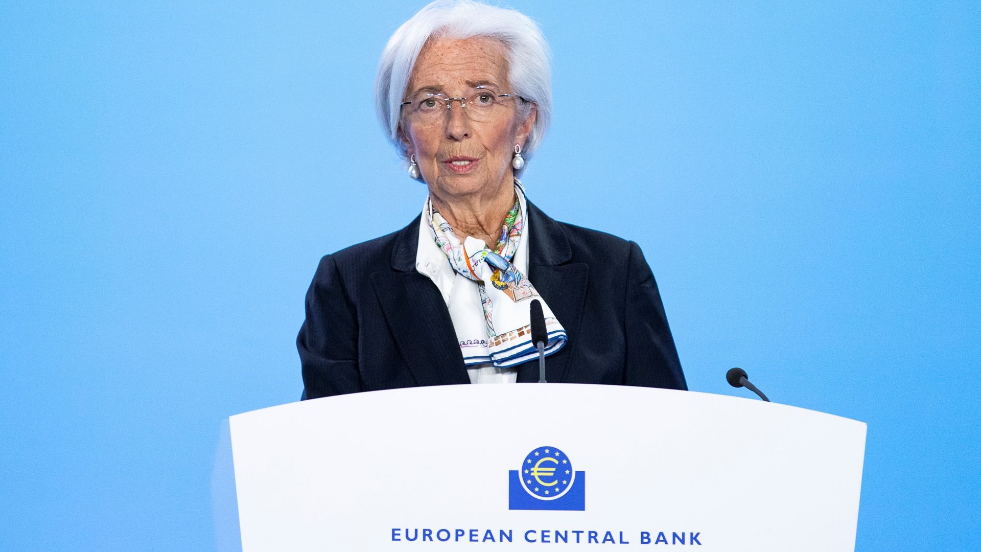 ECB president Christine Lagarde speaks behind a podium after a monetary policy decision
