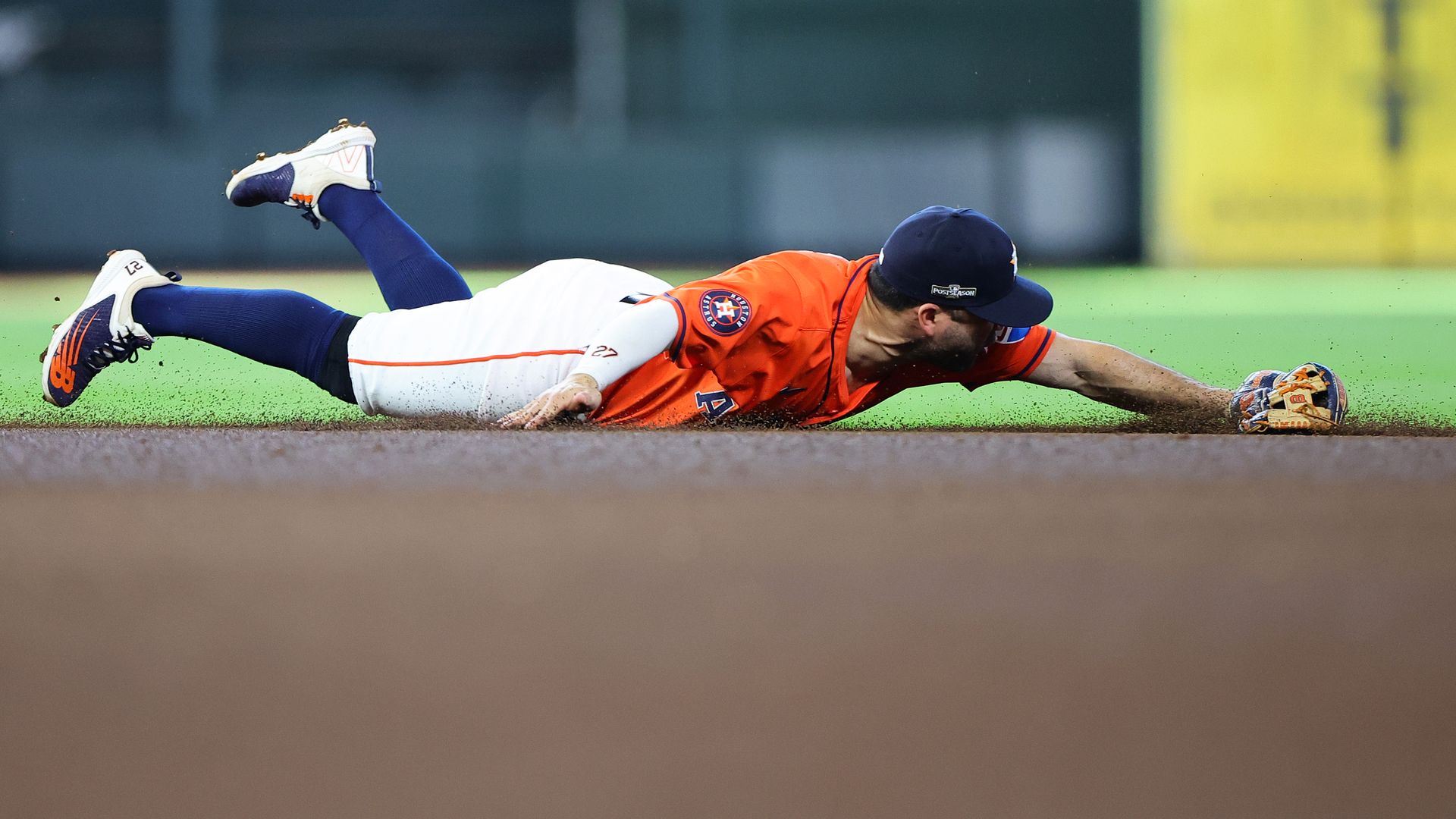Astros second baseman Jose Altuve dives for a ball but misses during Game 2 of the American League Wild Card series
