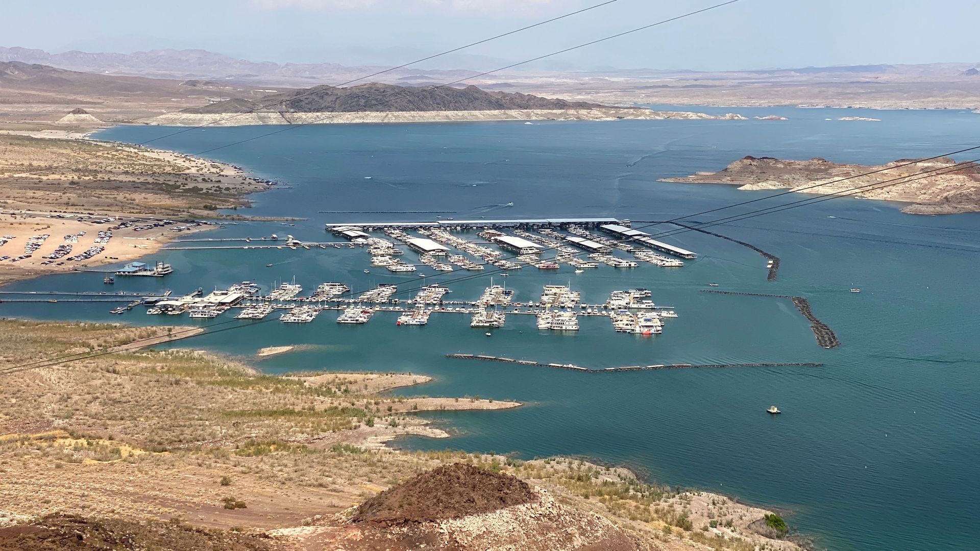 Photo showing dry ground extending toward boating docks on Lake Mead, Nevada.