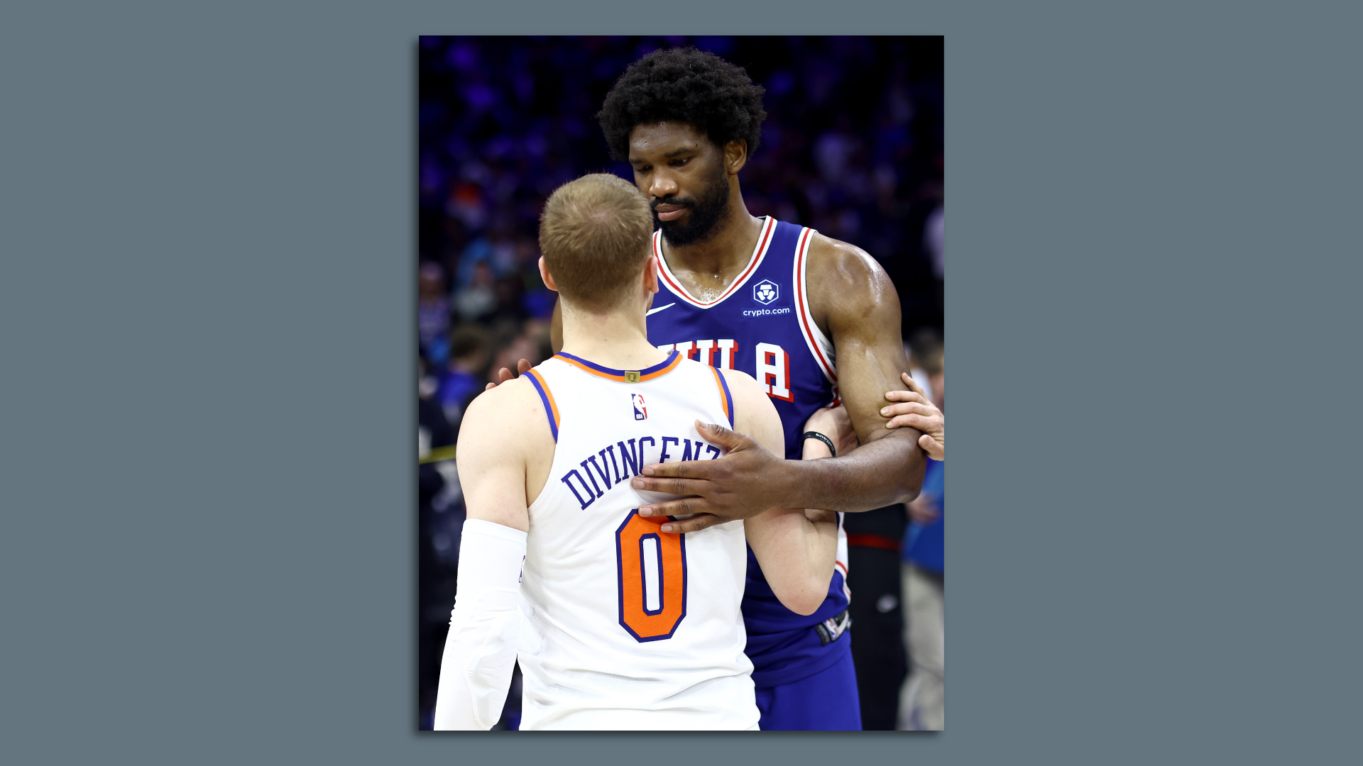 The SIxers' Joel Embiid embraces the Knicks' Donte DiVincenzo after Philly was eliminated from playoffs.