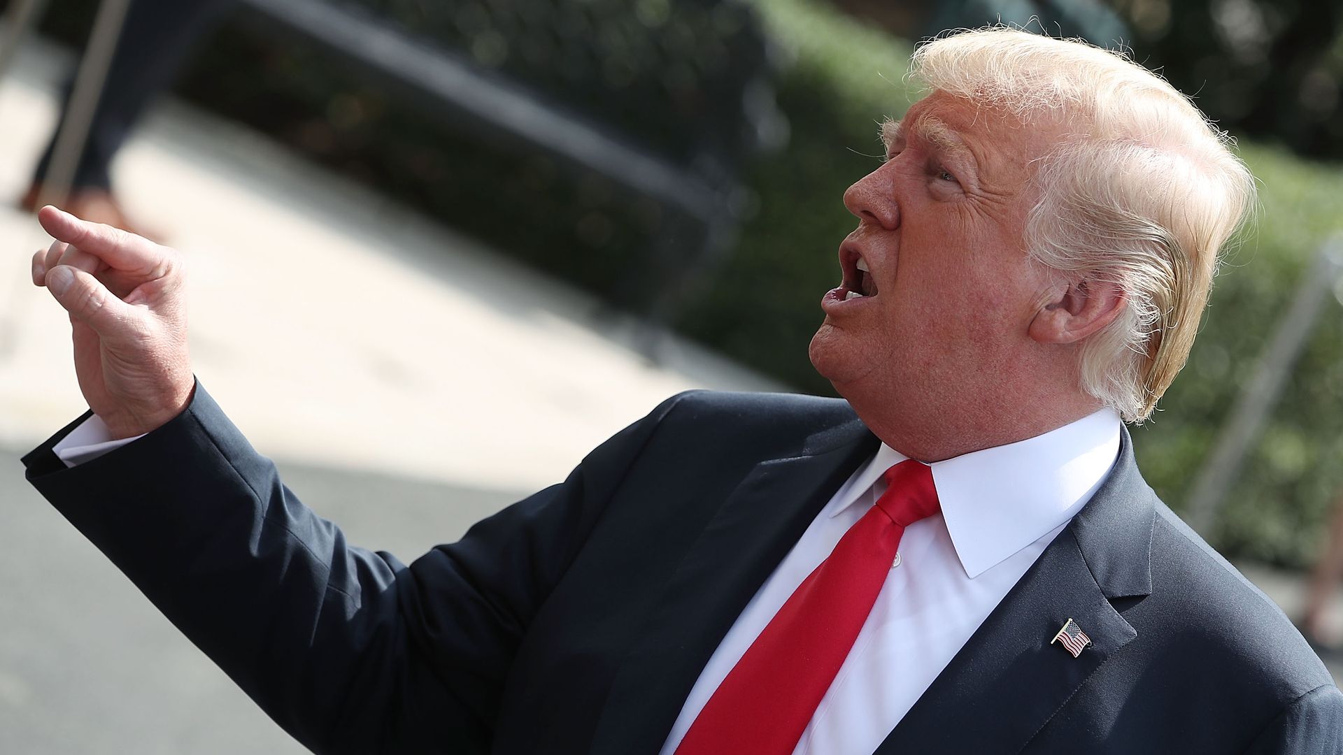 Donald Trump speaking and pointing his finger.