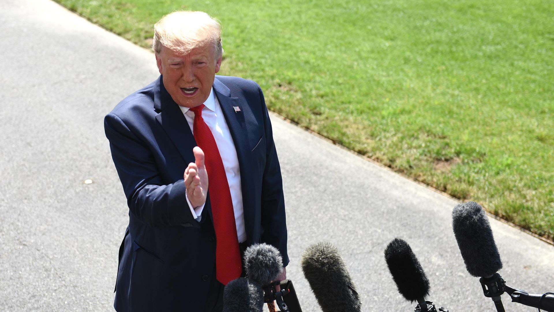 President Trump speaks with reporters.