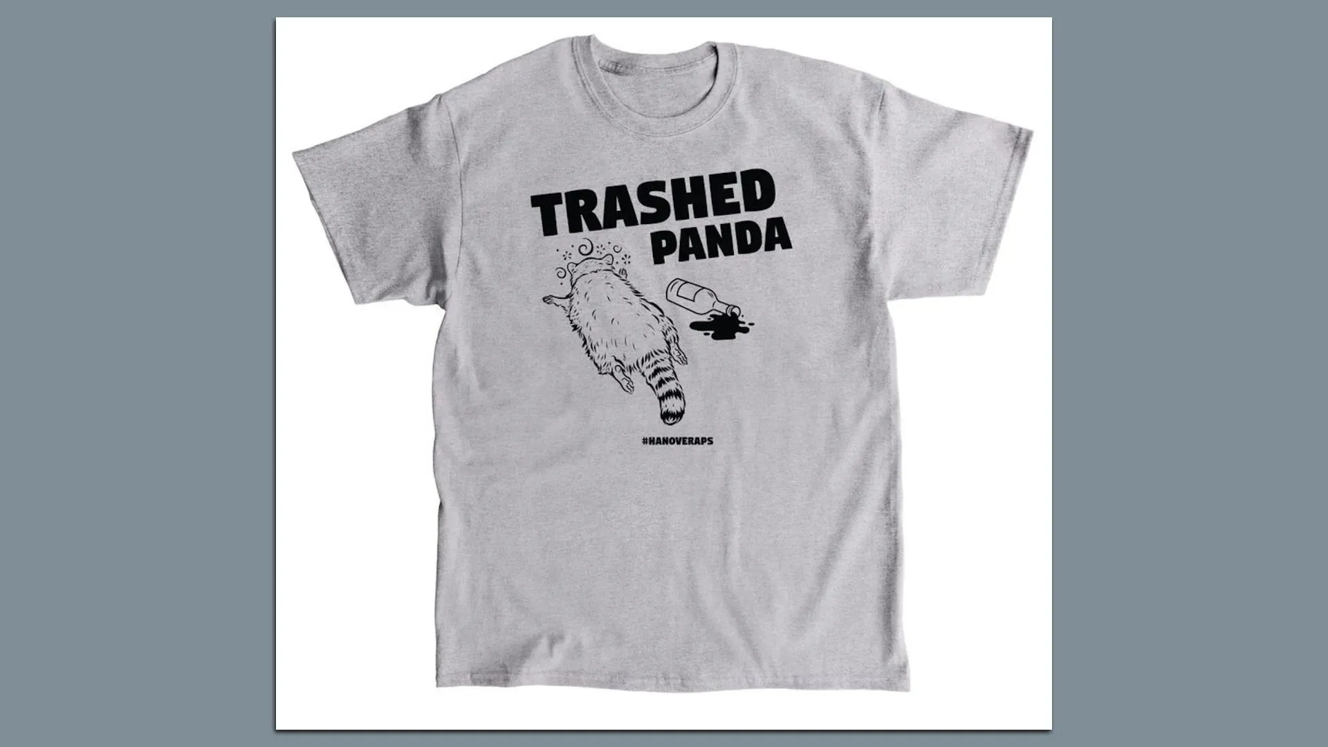 Light gray T-shirt with black text "TRASHED PANDA" above an illustration of a raccoon lying on its back next to a spilled bottle, with hashtag #HANOVERAPS below.
