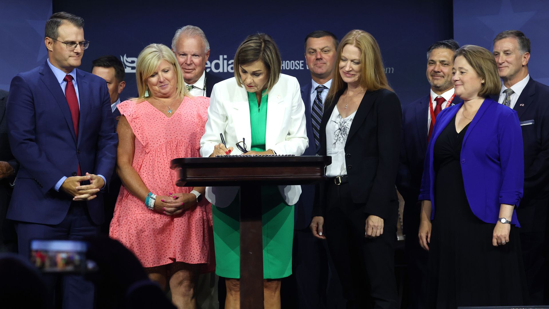 Kim reynolds signs a bill