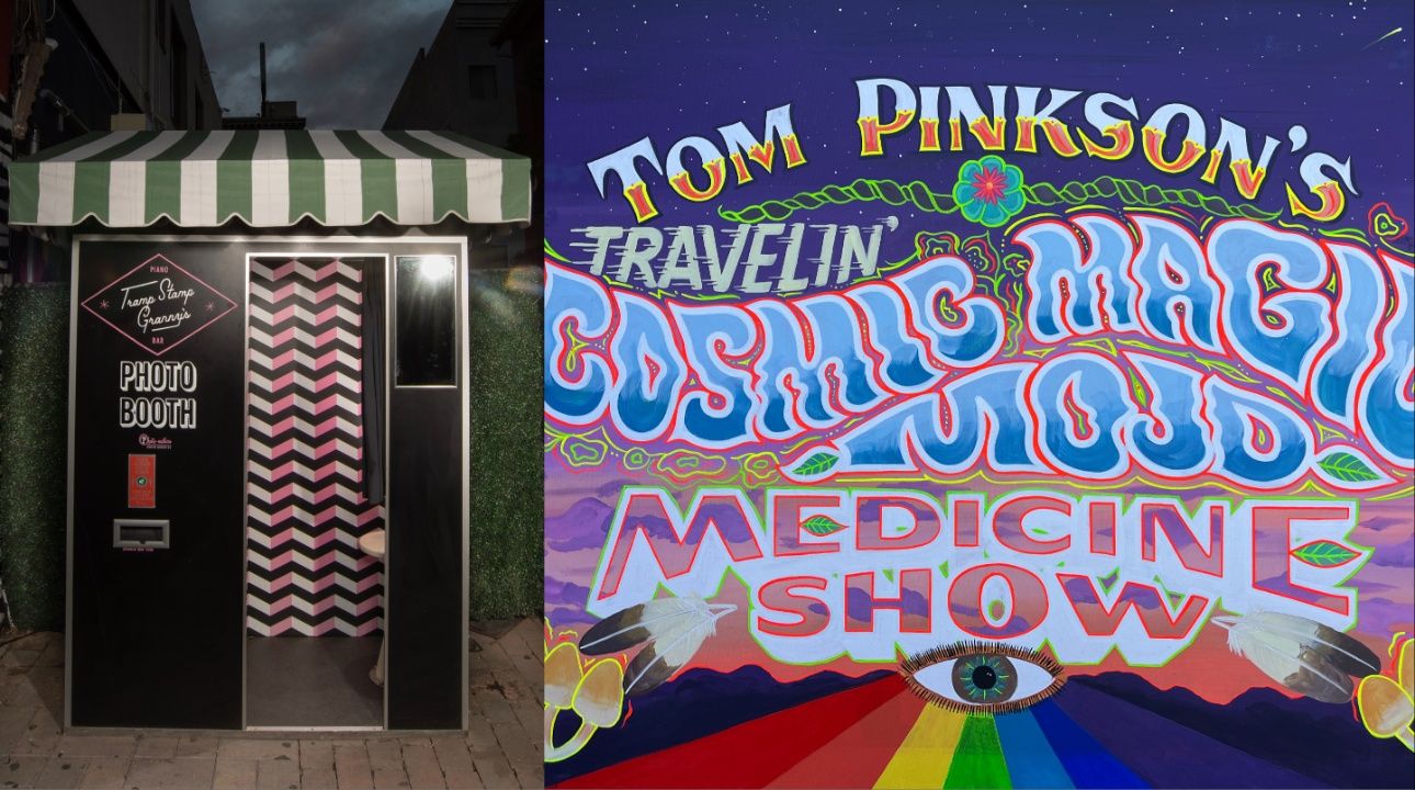 Photo booth with green and white striped canopy and chevron pink, white, and black interior on left; colorful mural on right reads "Tom Pinkson's Travelin Cosmic Magic Mojo Medicine Show" with eye and rainbow colors.