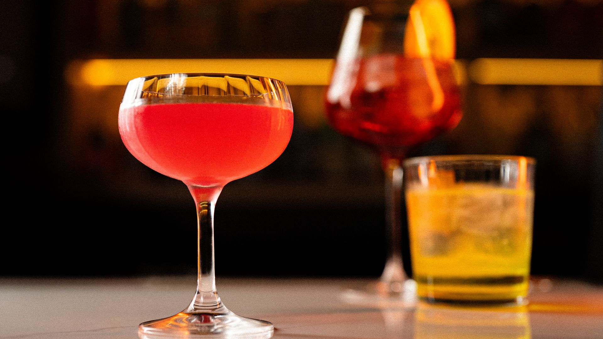 Photo of a three drinks on a table. 