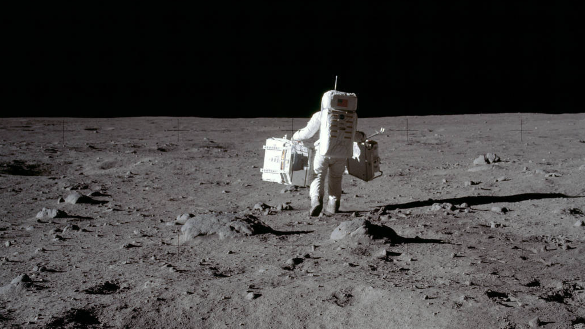 Person in spacesuit walks on the Moon
