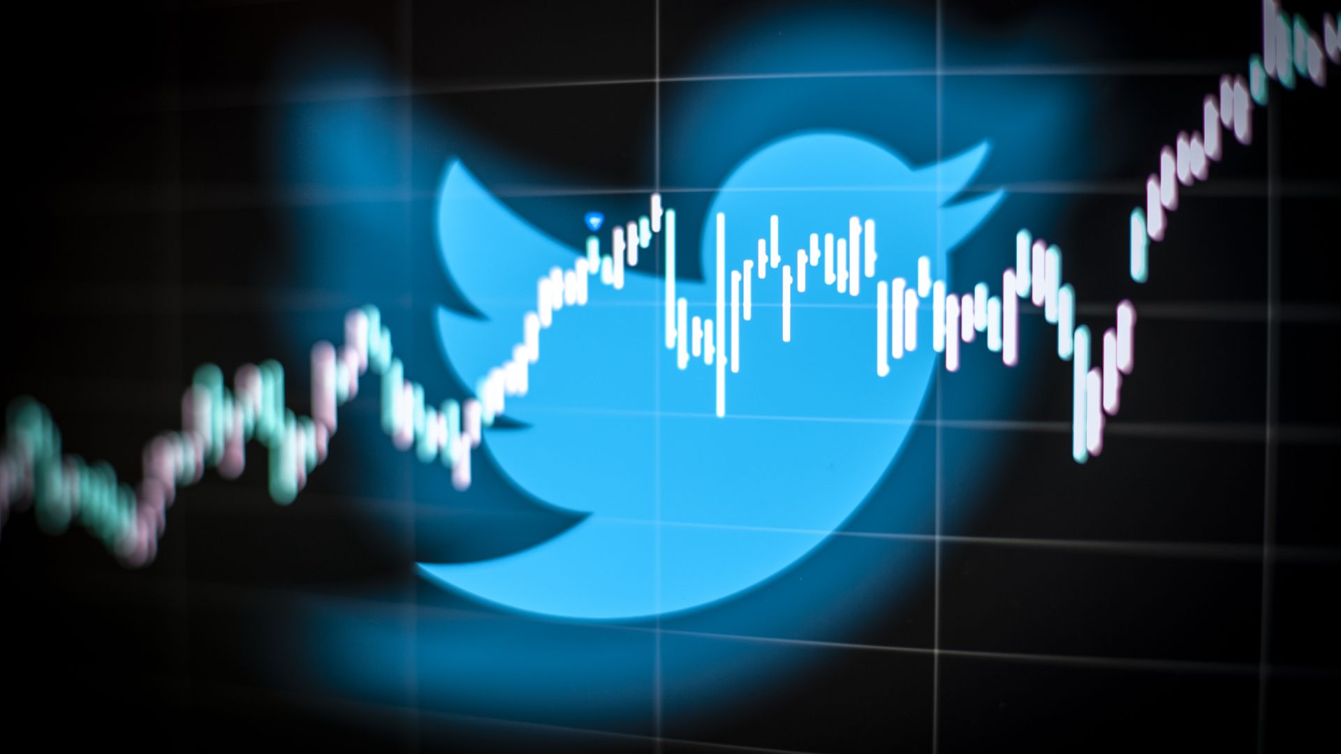 Photo illustration of Twitter logo with trend line going across it. 