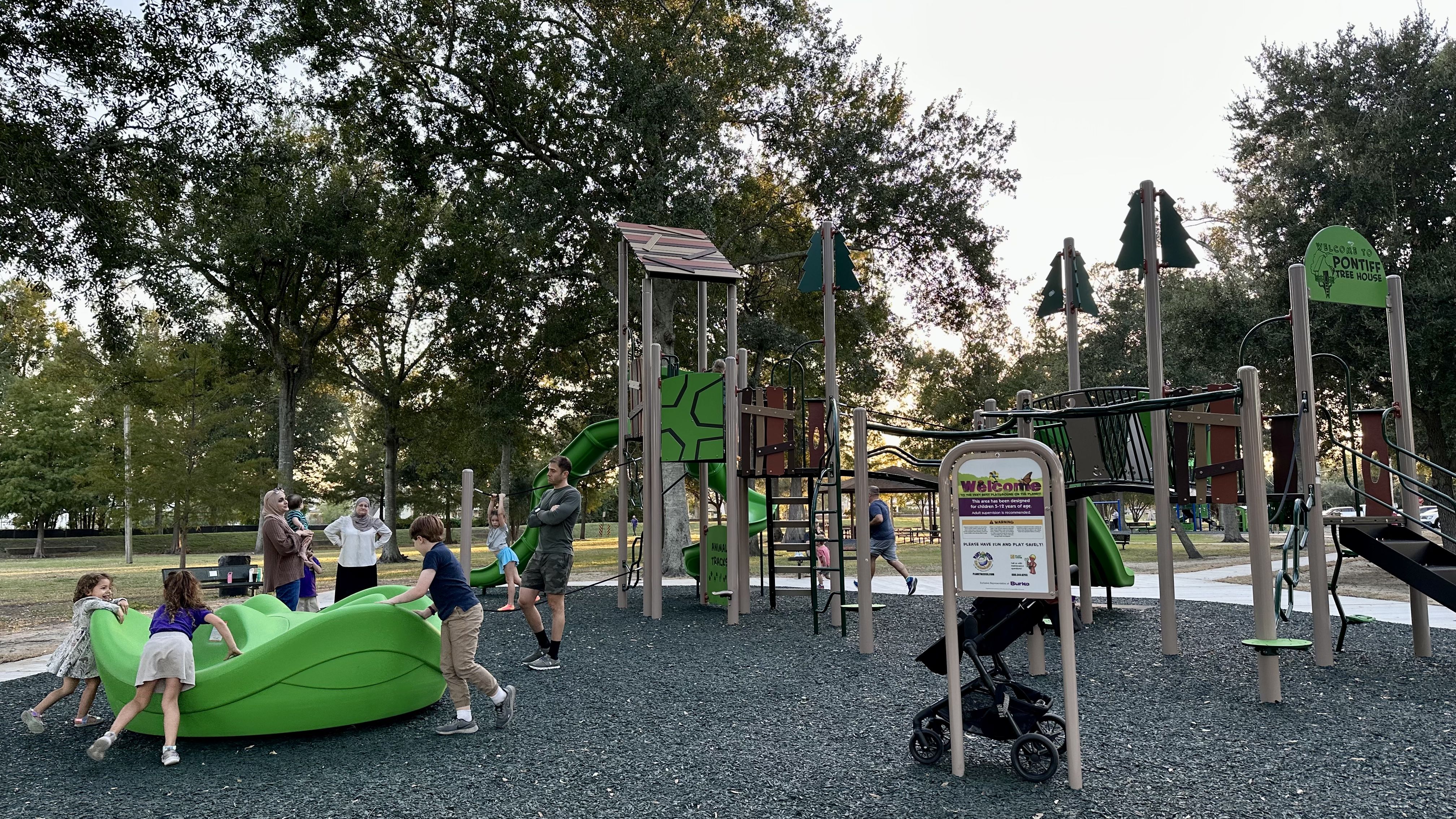 Photo shows children playing at the new playground in Old Metairie