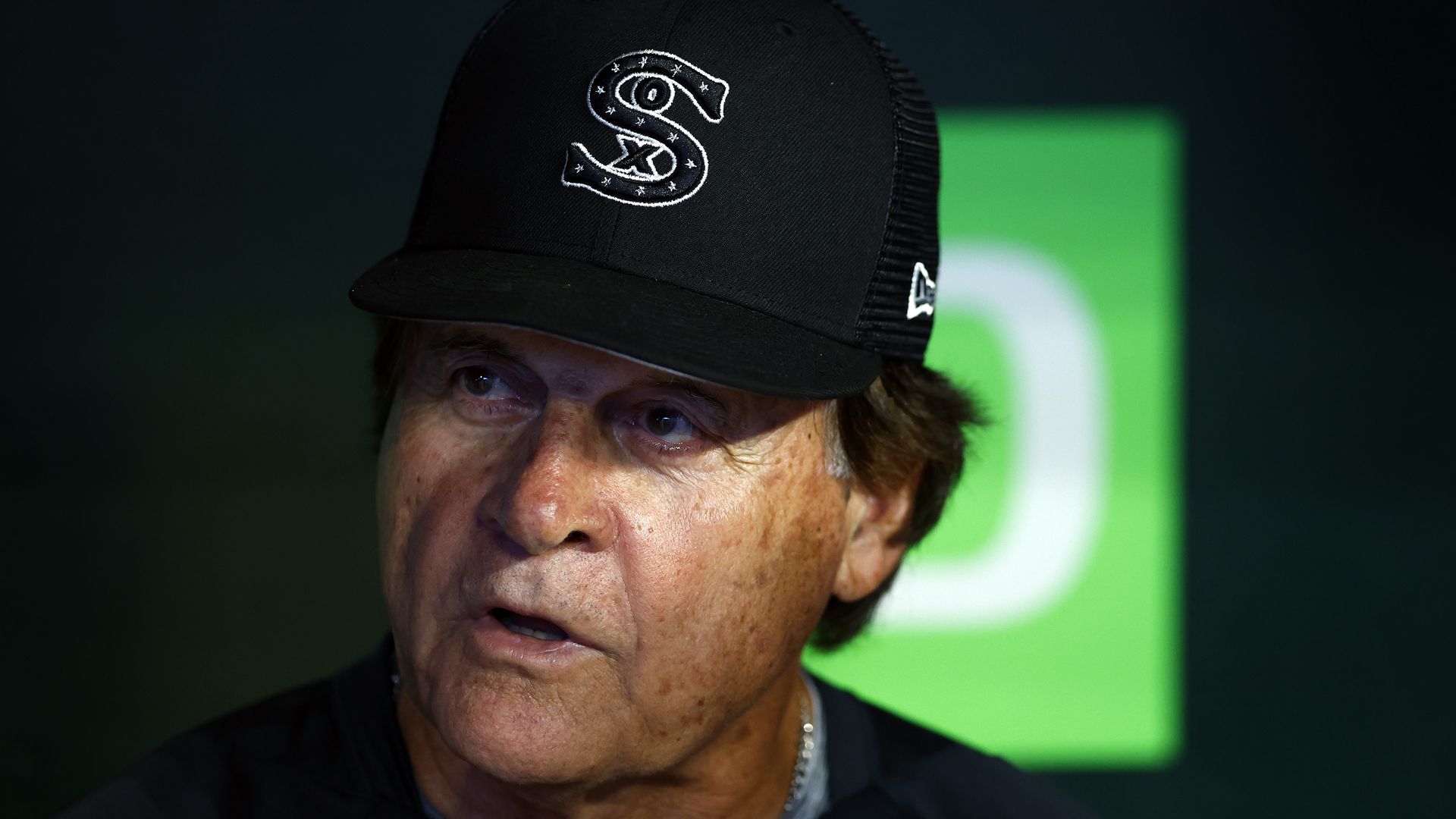 Photo of a baseball manager talking to the media. 