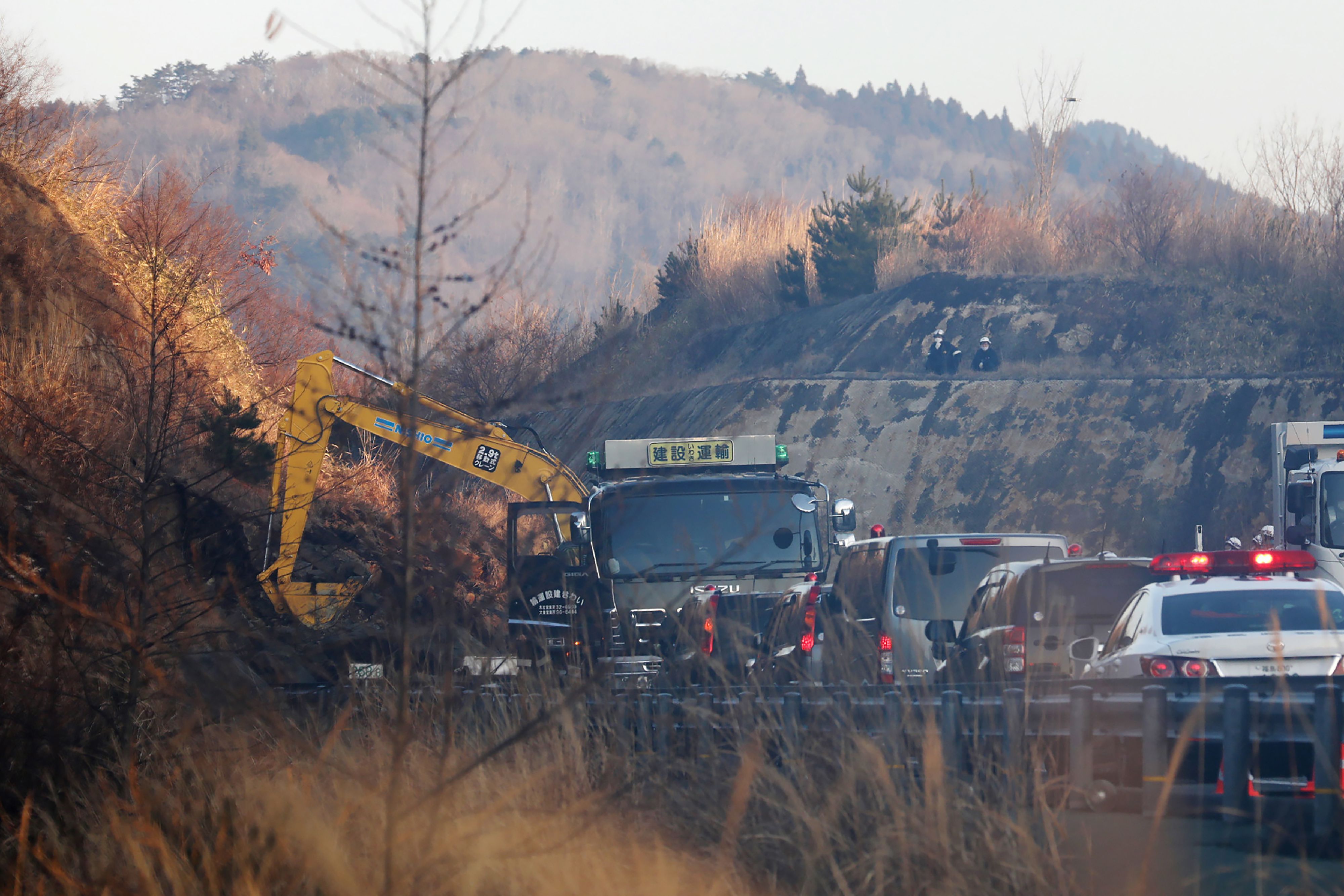 A power excavator heavy equipment for restoration work at the landslide site on the Joban Expressway in Soma, Fukushima prefecture on February 14