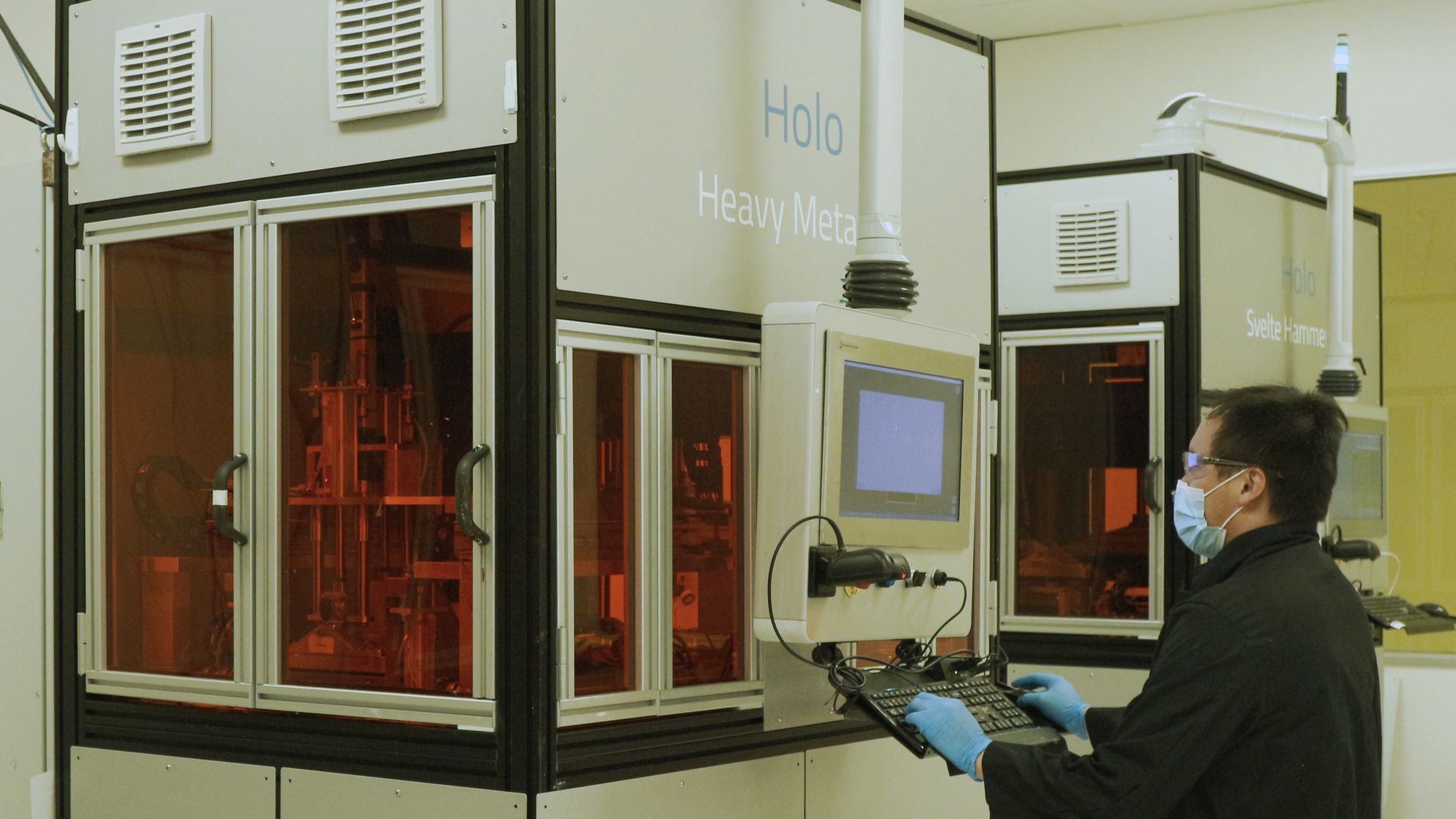 Picture of a person using a 3D printer 