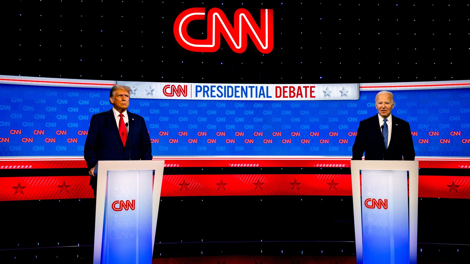 Donald Trump, left, and Joe Biden, right, stand on the debate stage
