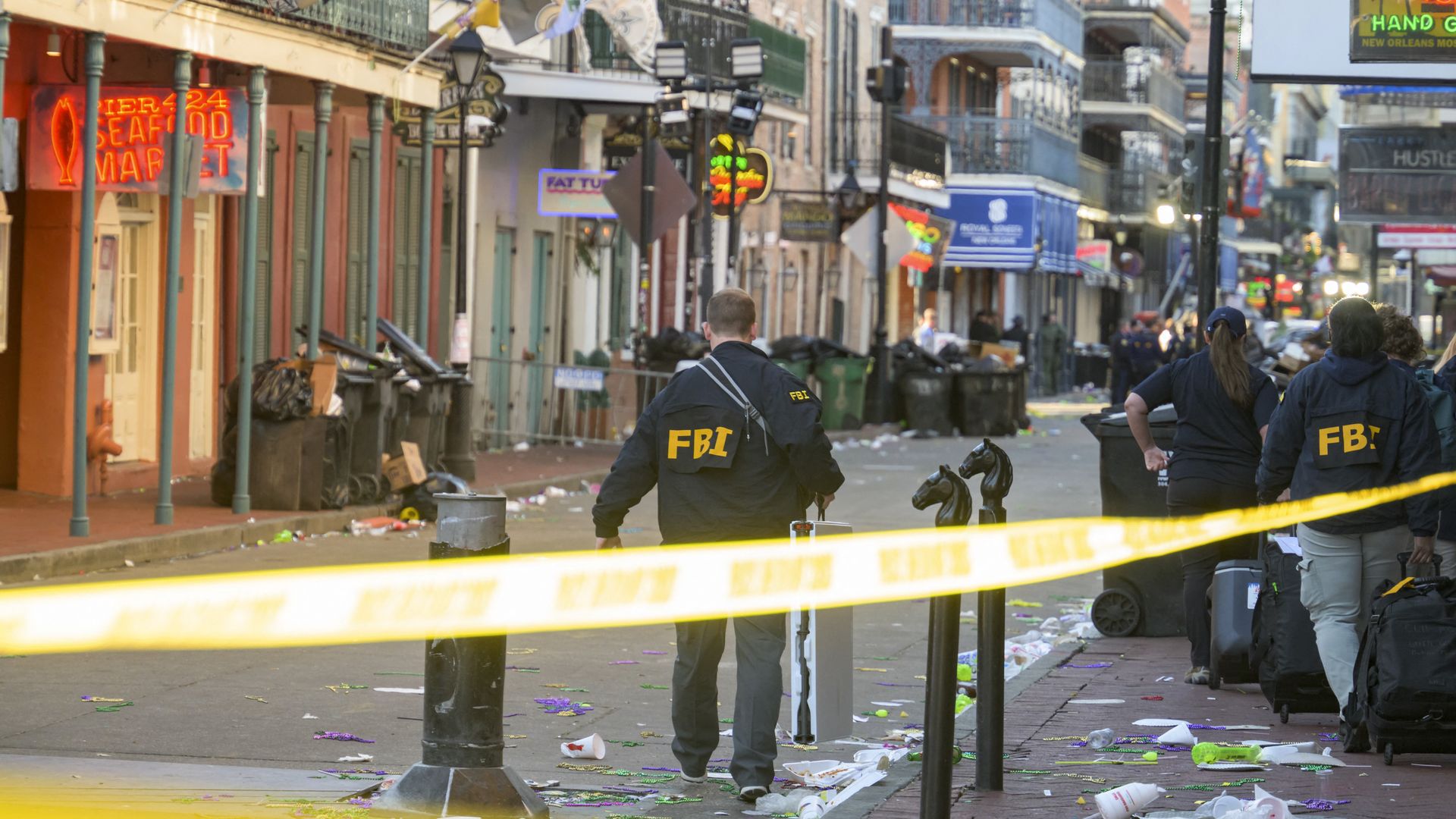 Photo shows FBI workers on Bourbon Street.