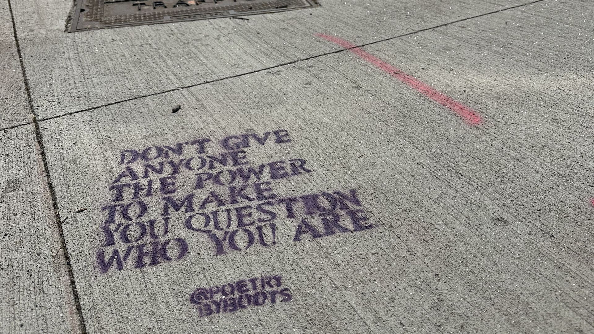 A stenciled poem written on the sidewalk in Union Square, which reads "Don't give anyone the power to make you question who you are." By @poetrybyboots