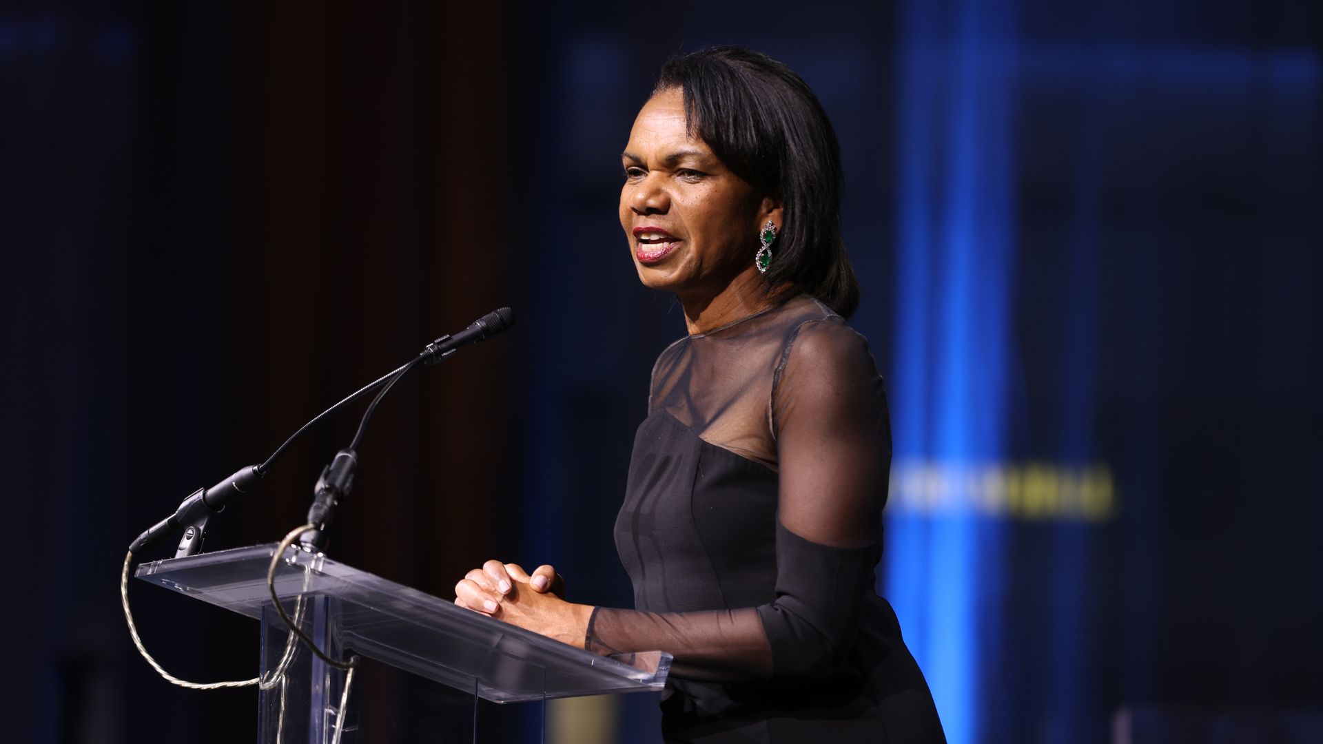 Condoleezza Rice speaks at a podium.
