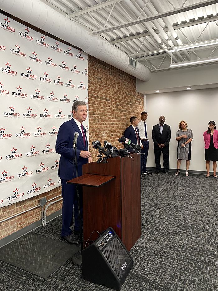 Roy Cooper at StarMed, vaccines, North Carolina, COVID-19