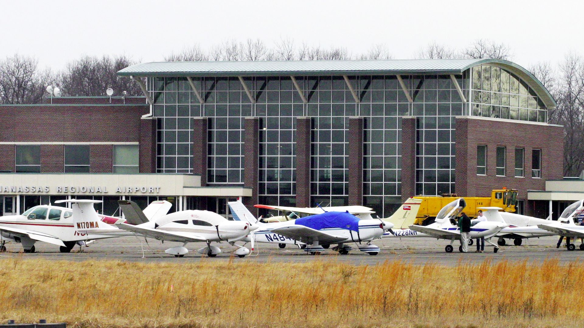 Manassas Regional Airport with small planes parked out front 