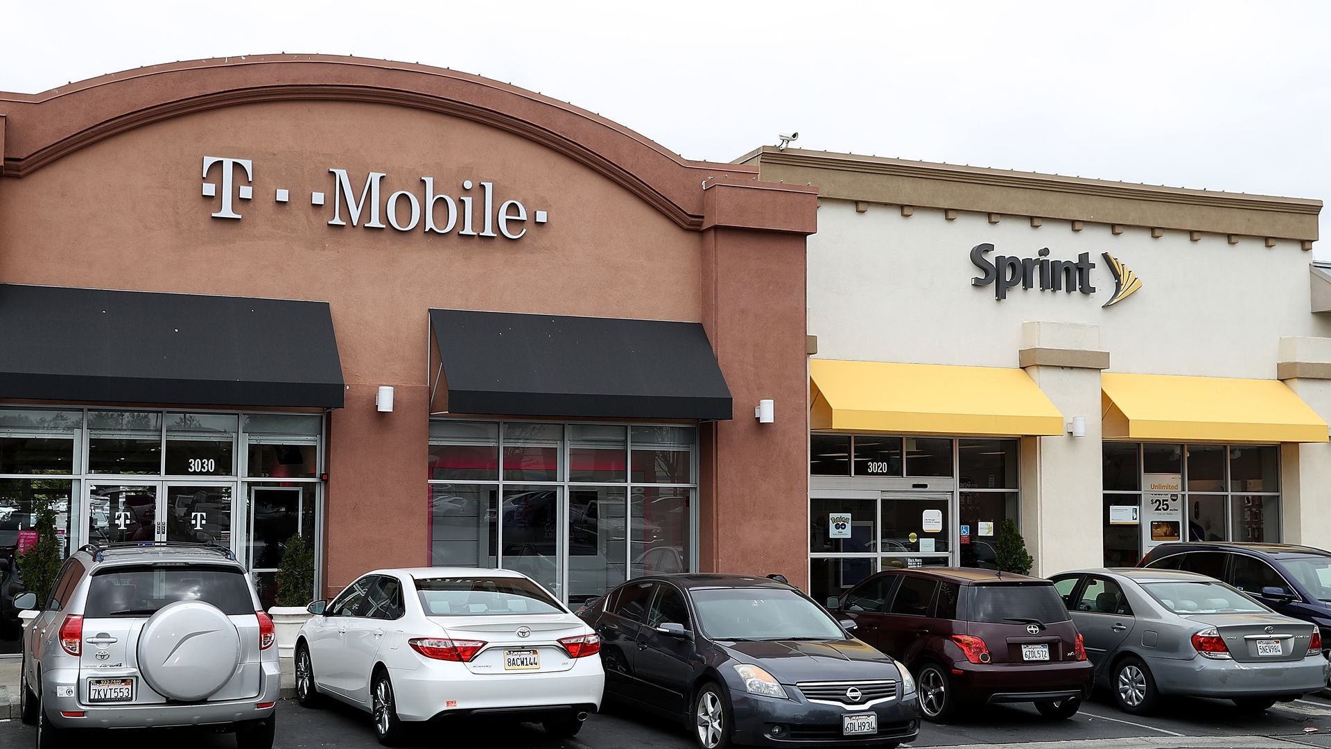 T-Mobile and Sprint storefronts appear side by side.