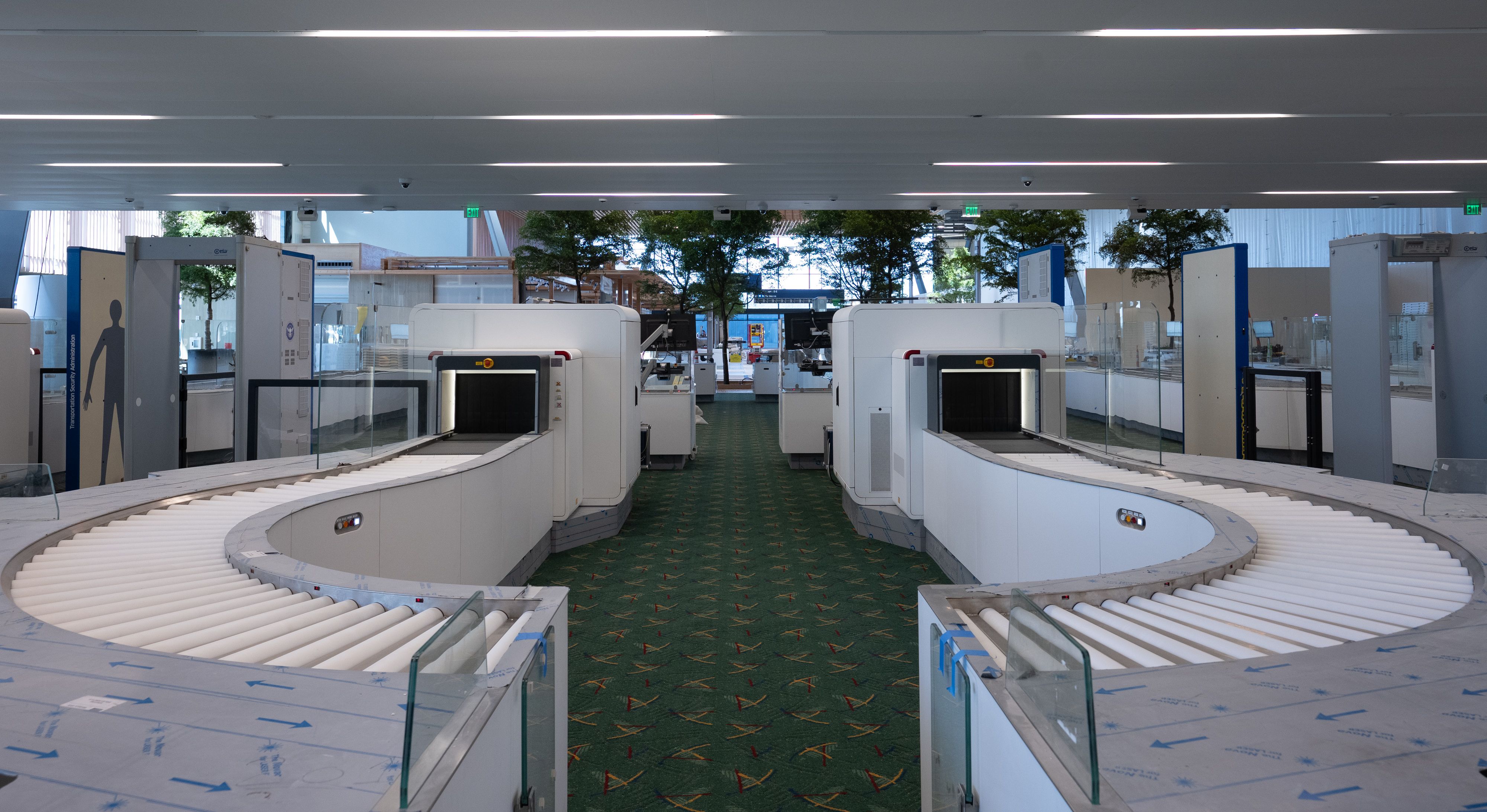 A photo of x-ray machines at the airport security checkpoint.