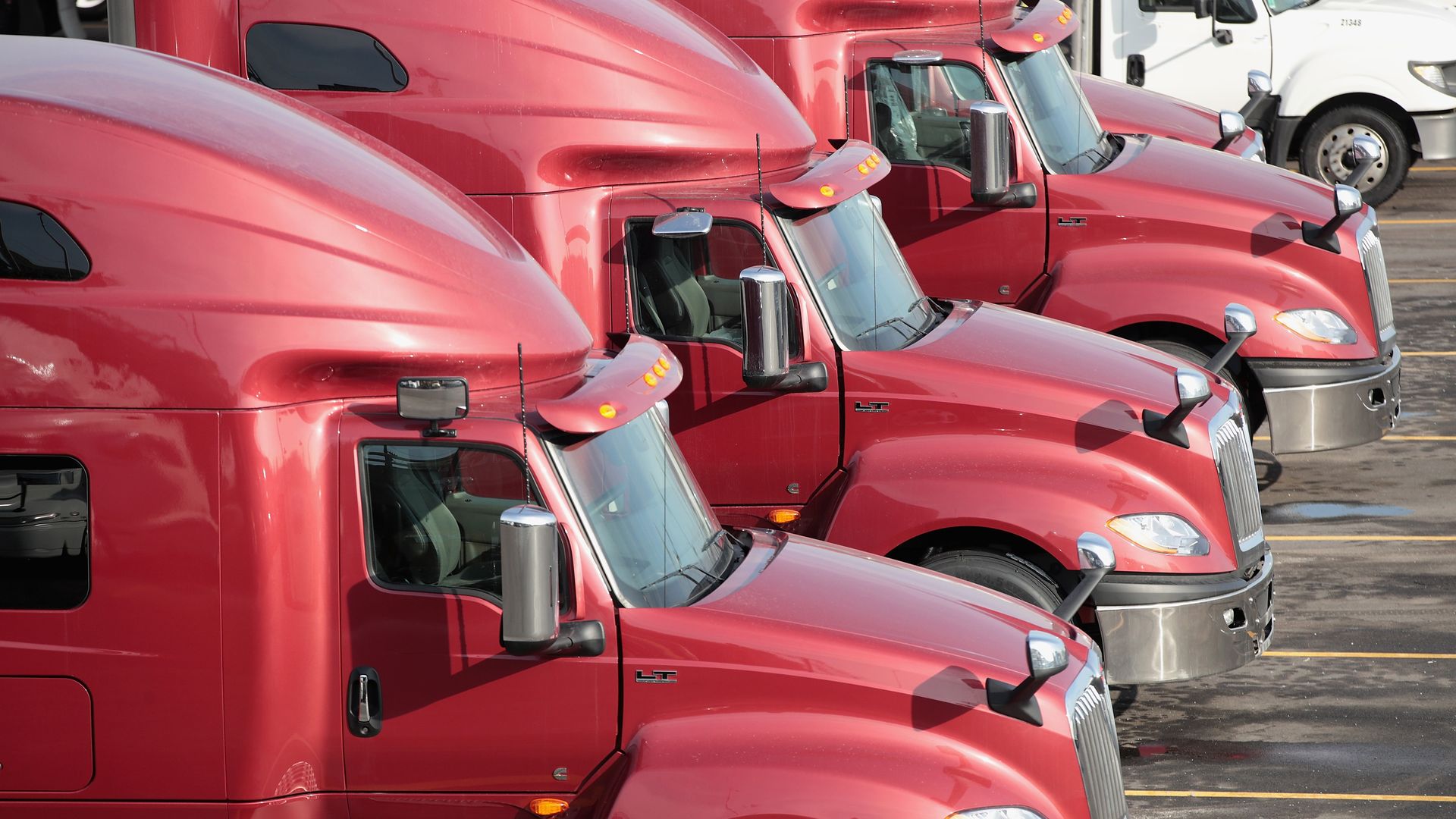 Freight trucks parked in a parking lot