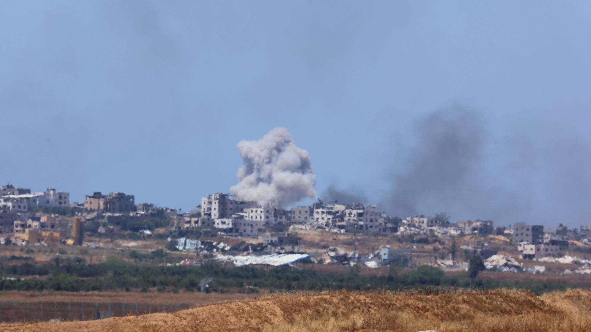 Smoke billows following Israeli strikes in the northern Gaza Strip as seen from Israel's southern border, on May 16, 2024.