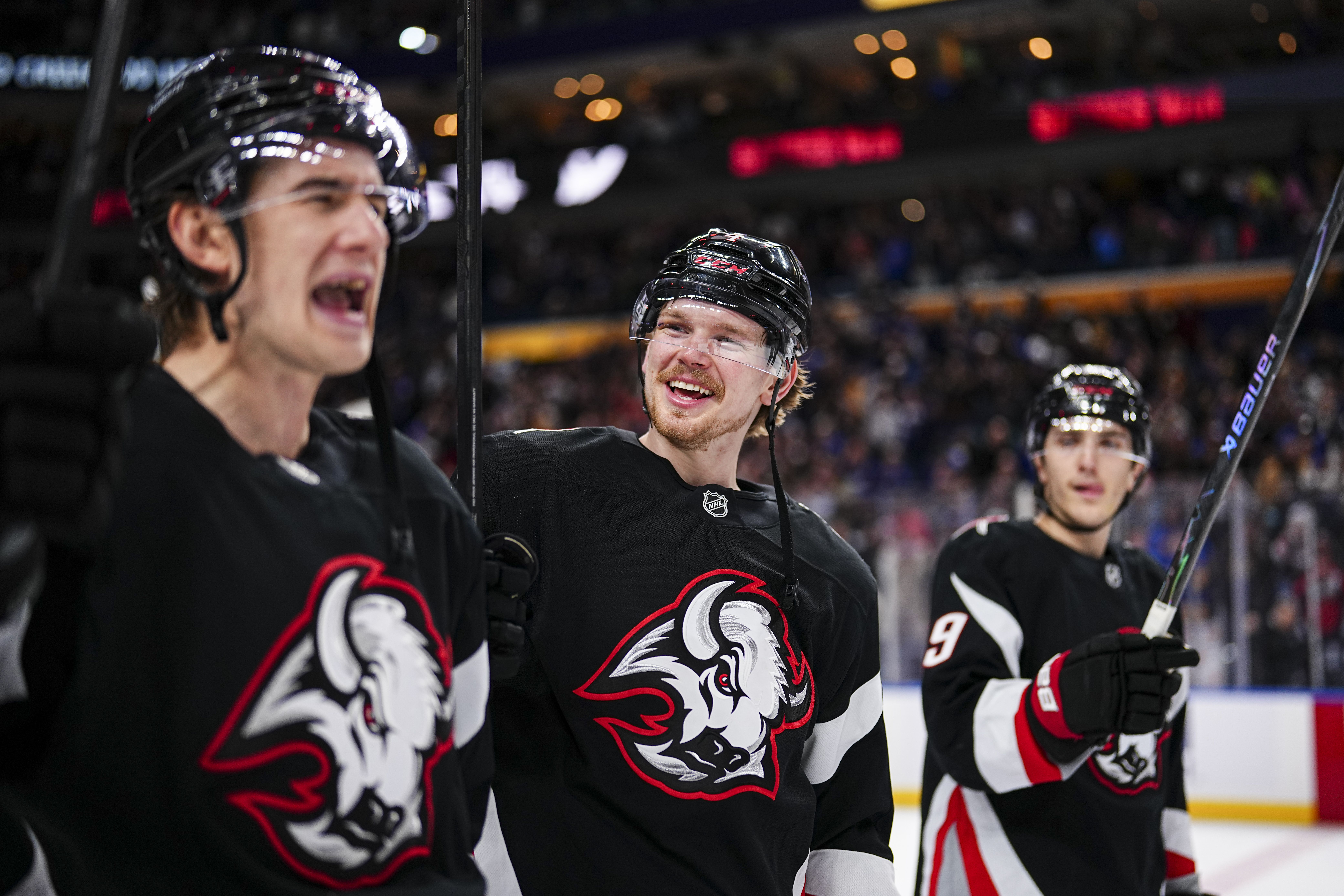 Bowen Byram #4 of the Buffalo Sabres celebrates with teammates after defeating the Seattle Kraken 3-2 in an NHL game on March 28, 2026 at KeyBank Center in Buffalo, New York.