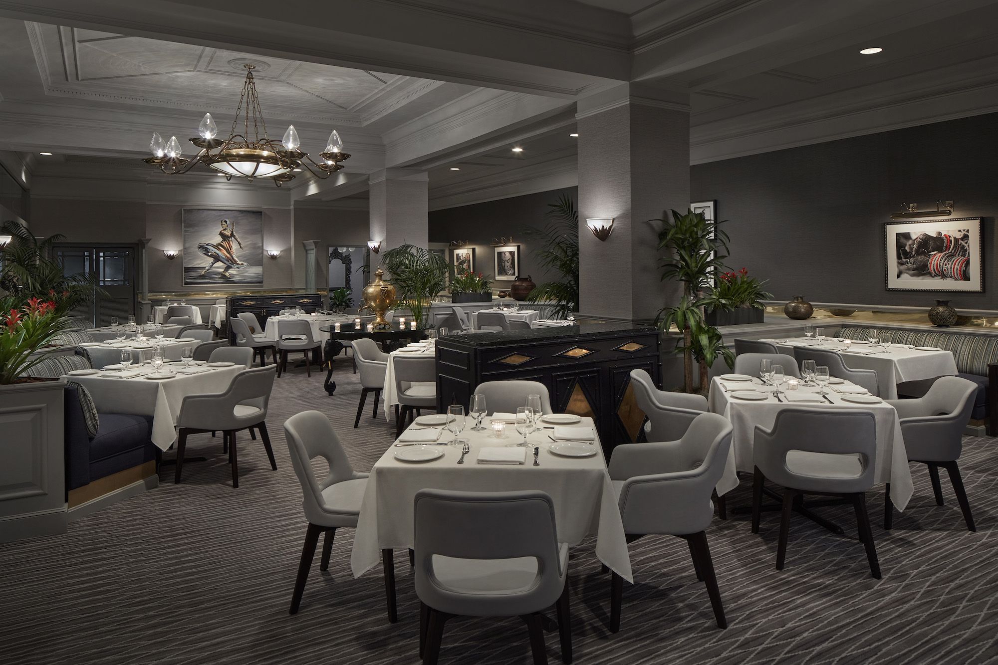 Bombay Club's dining room with tablecloths and dark grey walls