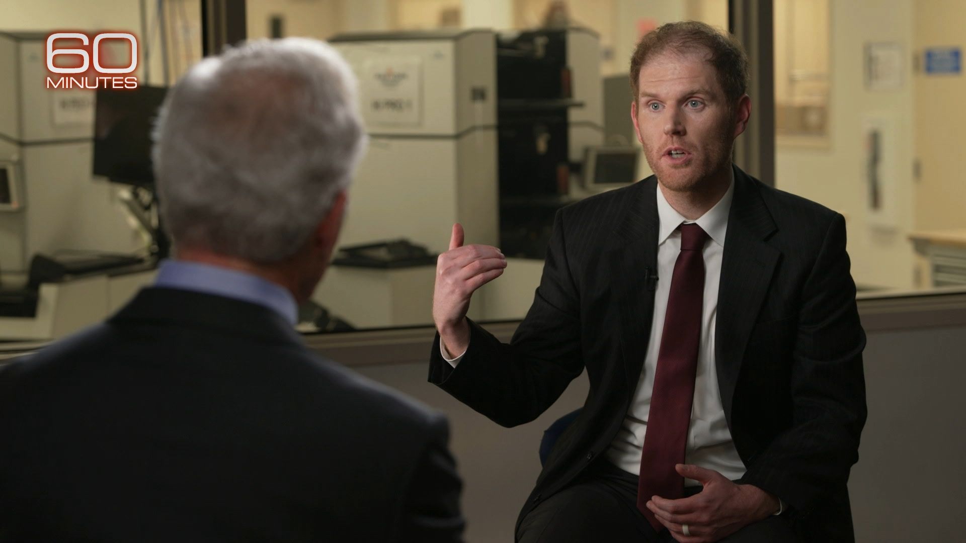 Stephen Richer gestures with his hand while speaking to Scott Pelley during a 60 Minutes interview.