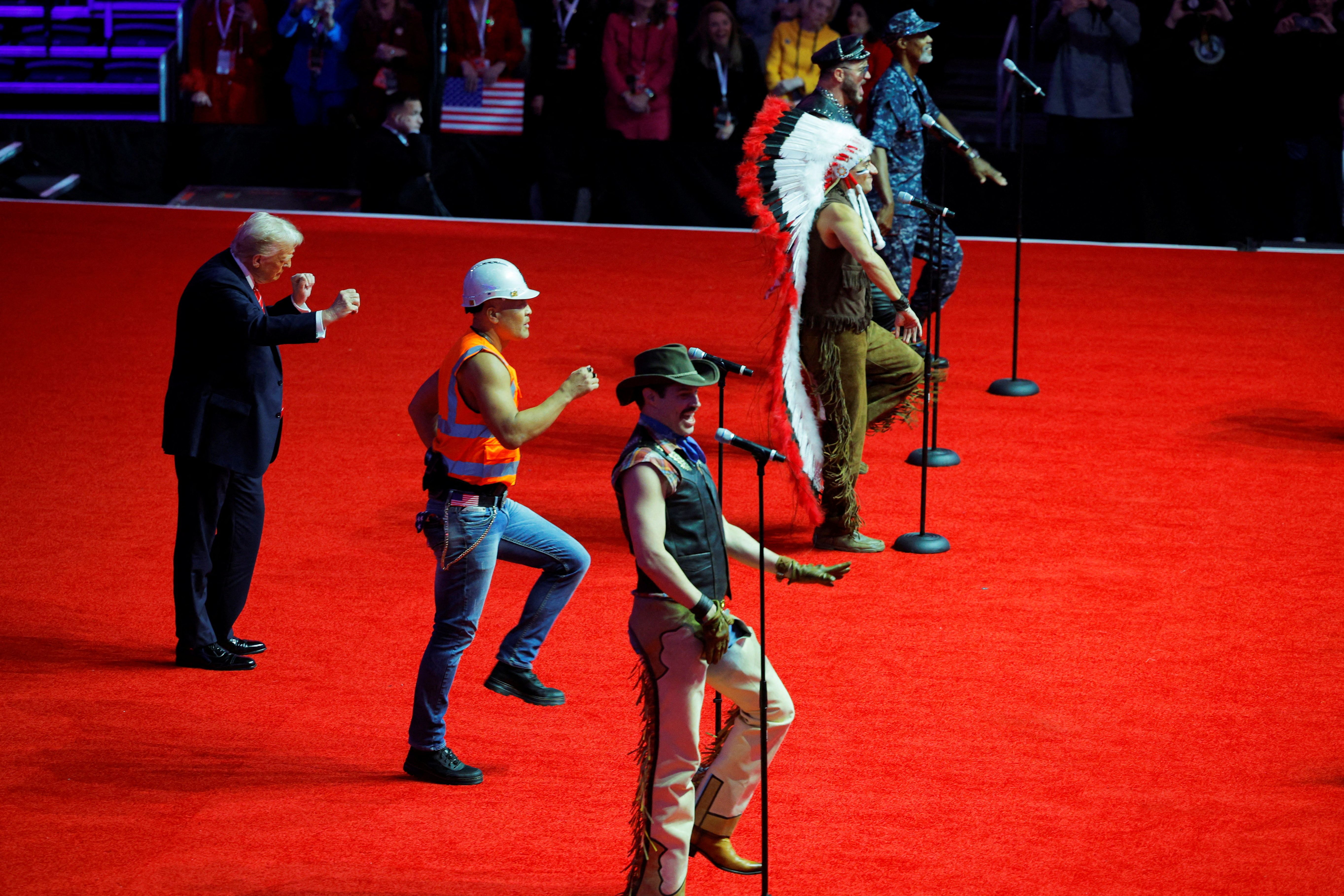 U.S. President-elect Donald Trump dances onstage as the Village People perform during a rally the day before he is scheduled to be inaugurated for a second term, in Washington, U.S., January 19, 2025. REUTERS/Brian Snyder