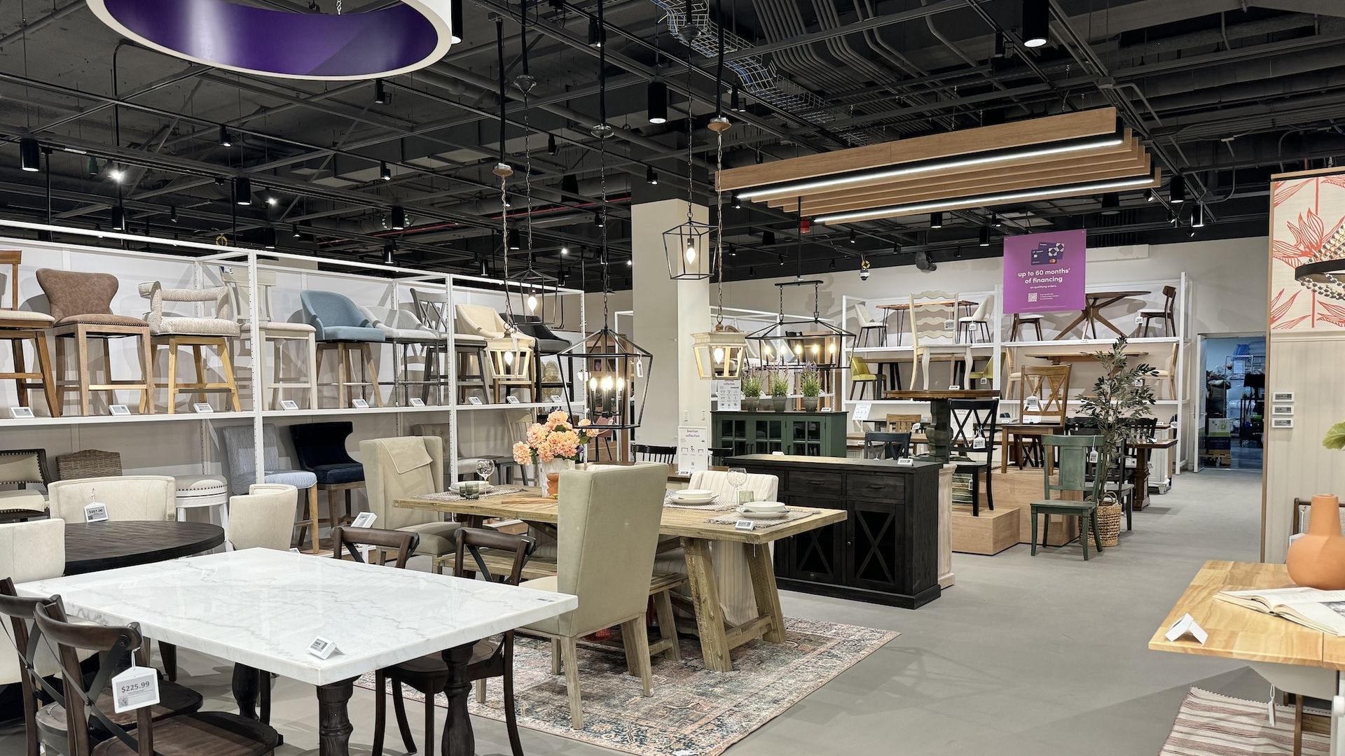 Inside of store with dining tables, chairs and counters