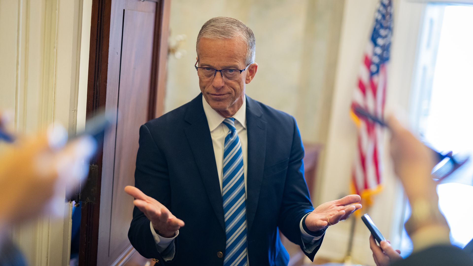 Senate Majority Leader John Thune talks with reporters at the U.S. Capitol on July 23.