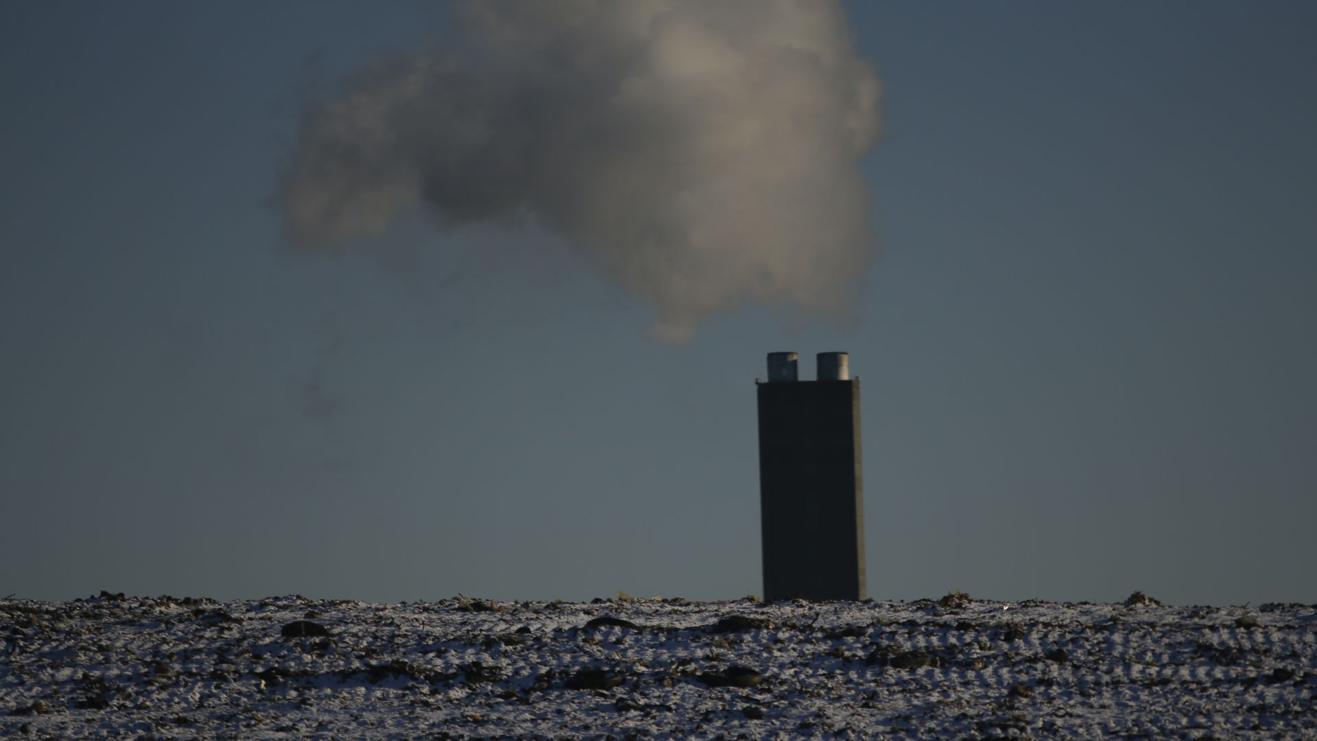 A factory emits smoke