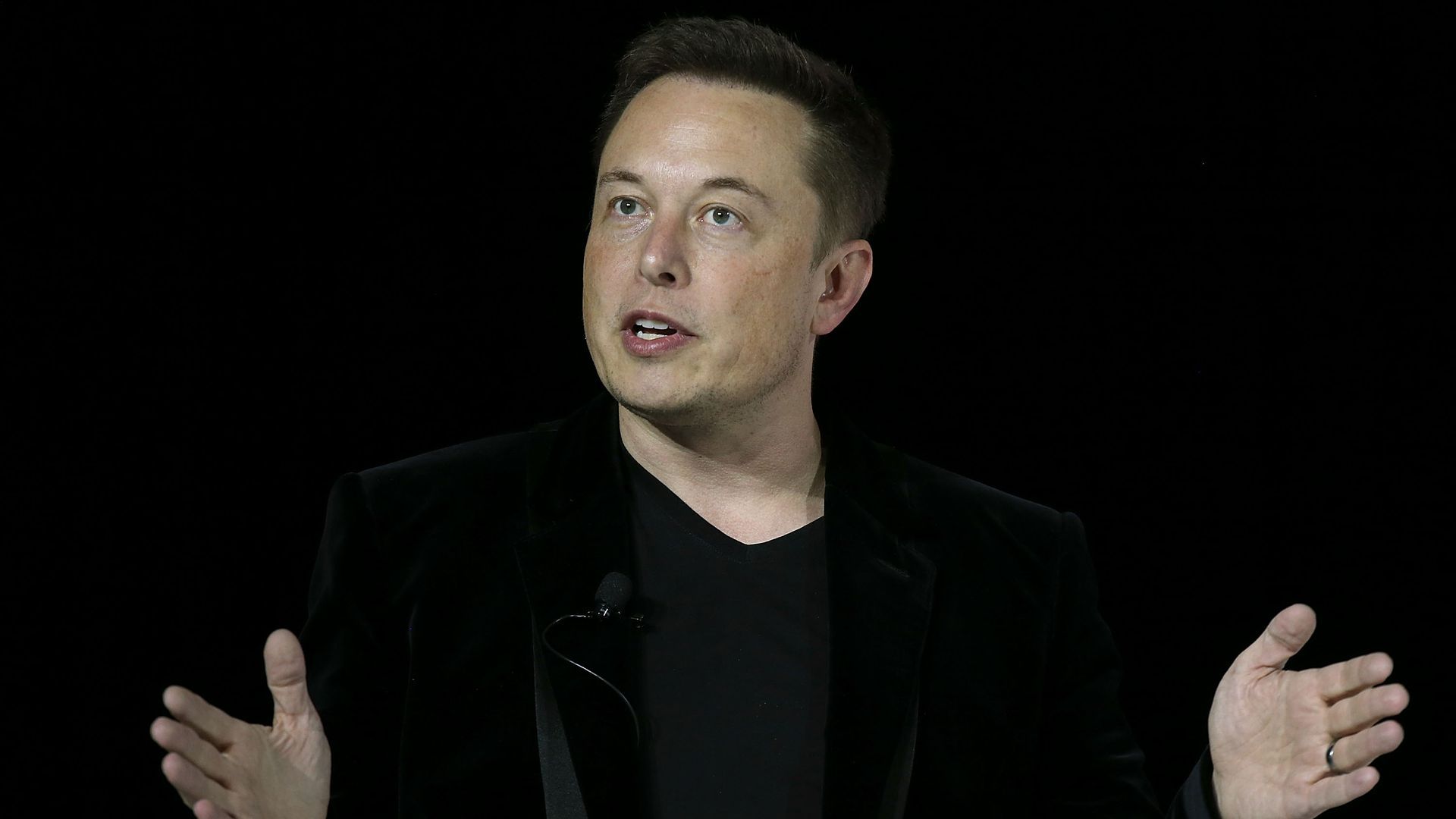 Elon Musk speaking on stage