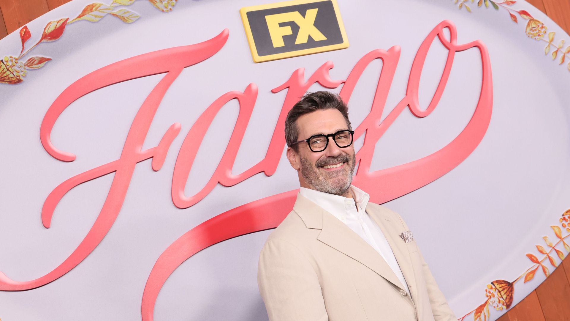 Jon Hamm in front of a Fargo sign
