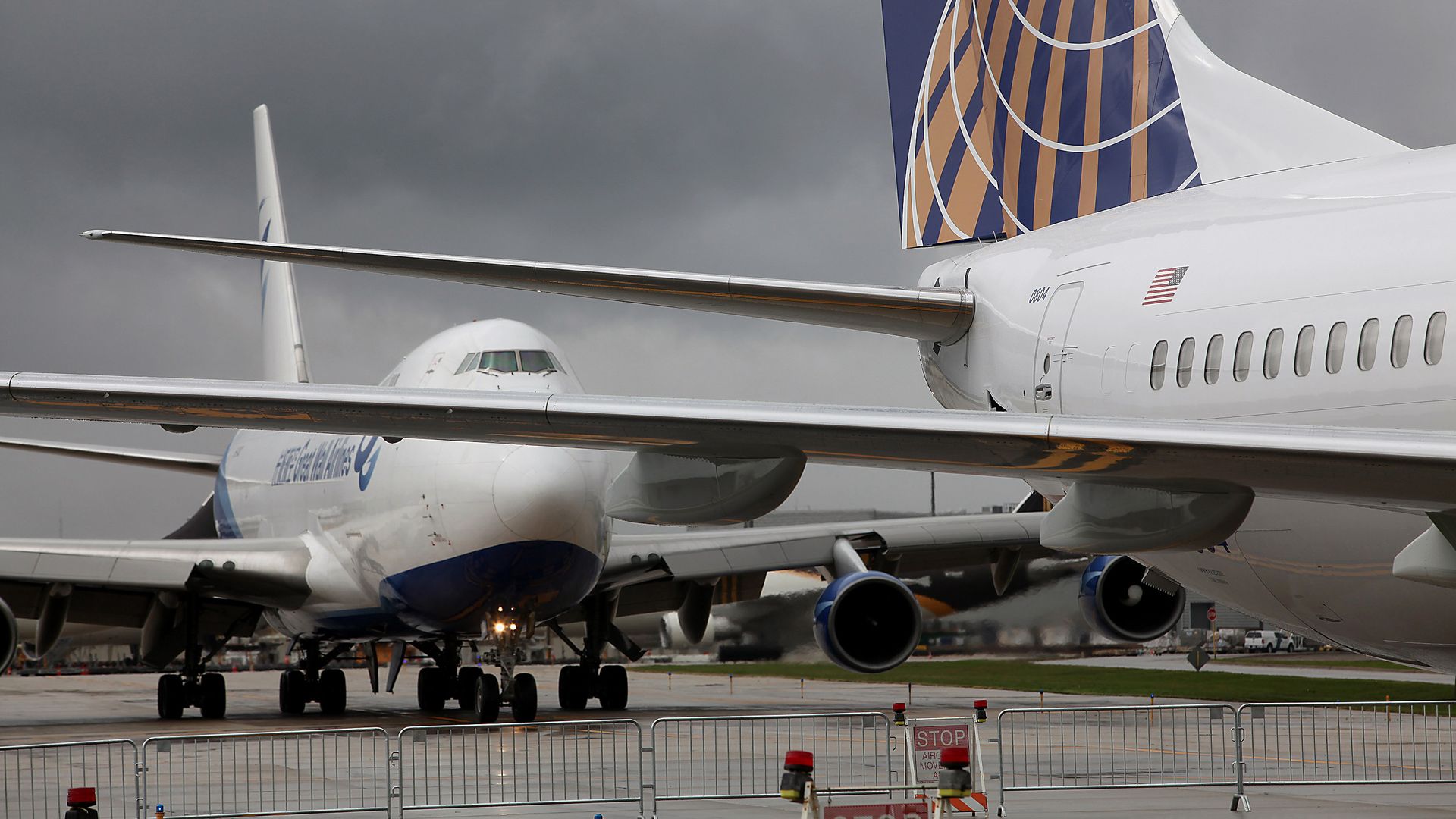 Photo of two planes lining up on a runway. 