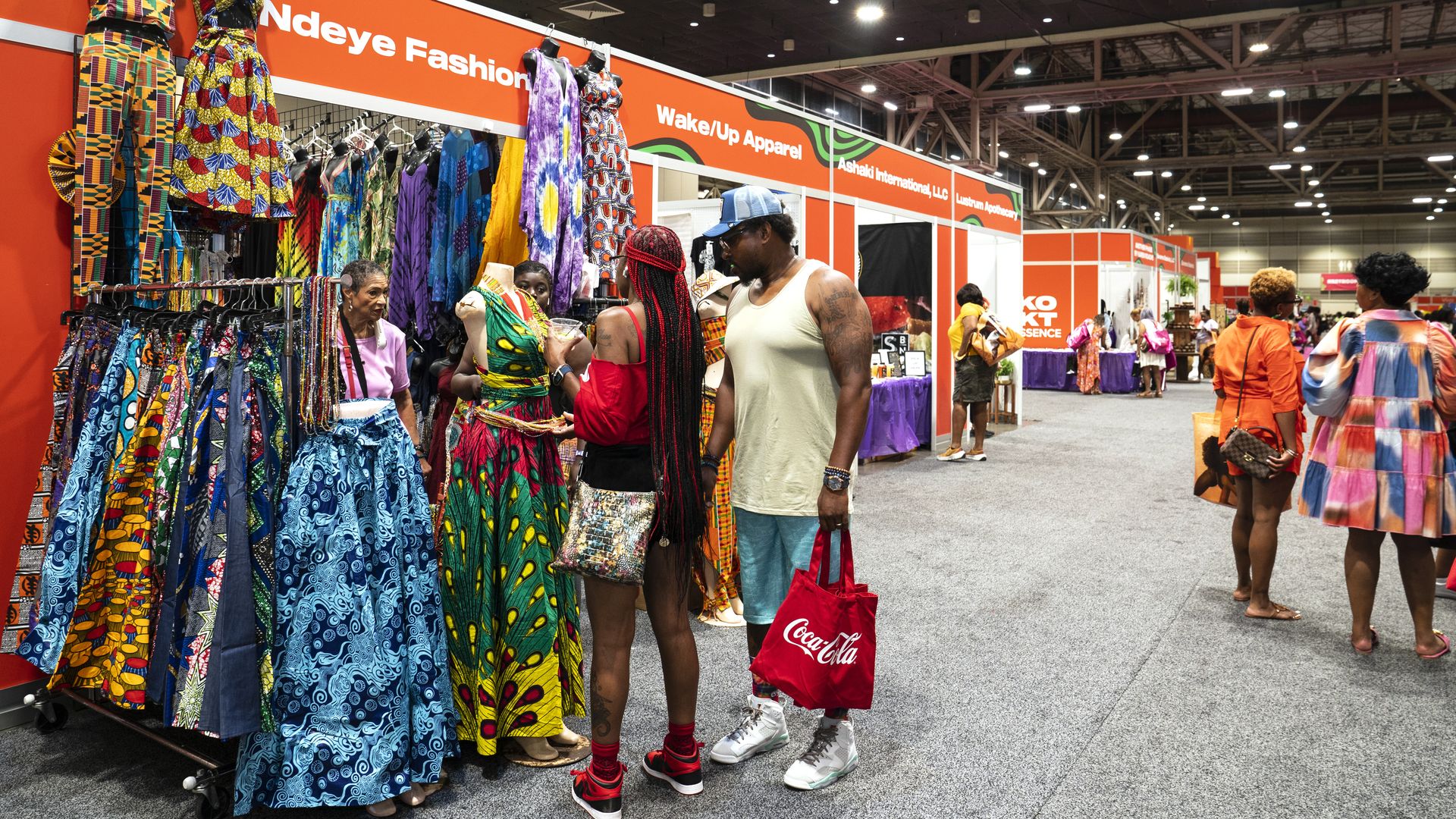 Photo shows a picture of people shopping.