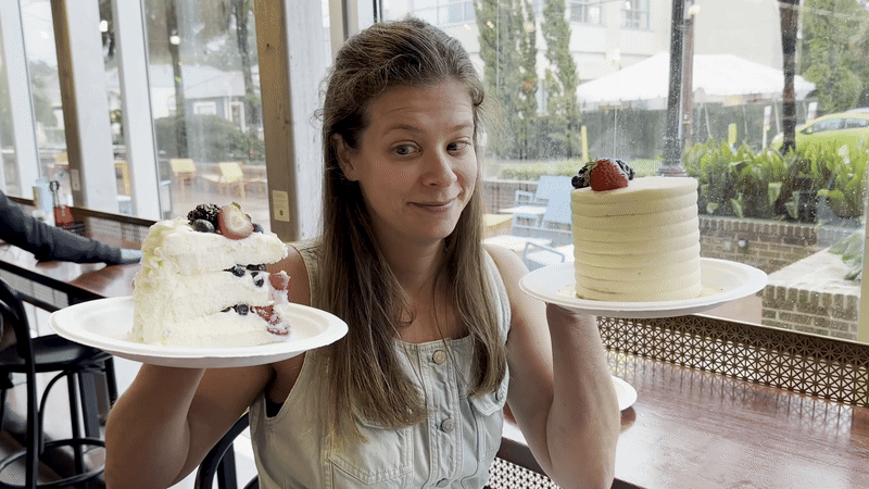 Image shows Chelsea Brasted looking at two pieces of berry Chantilly cake
