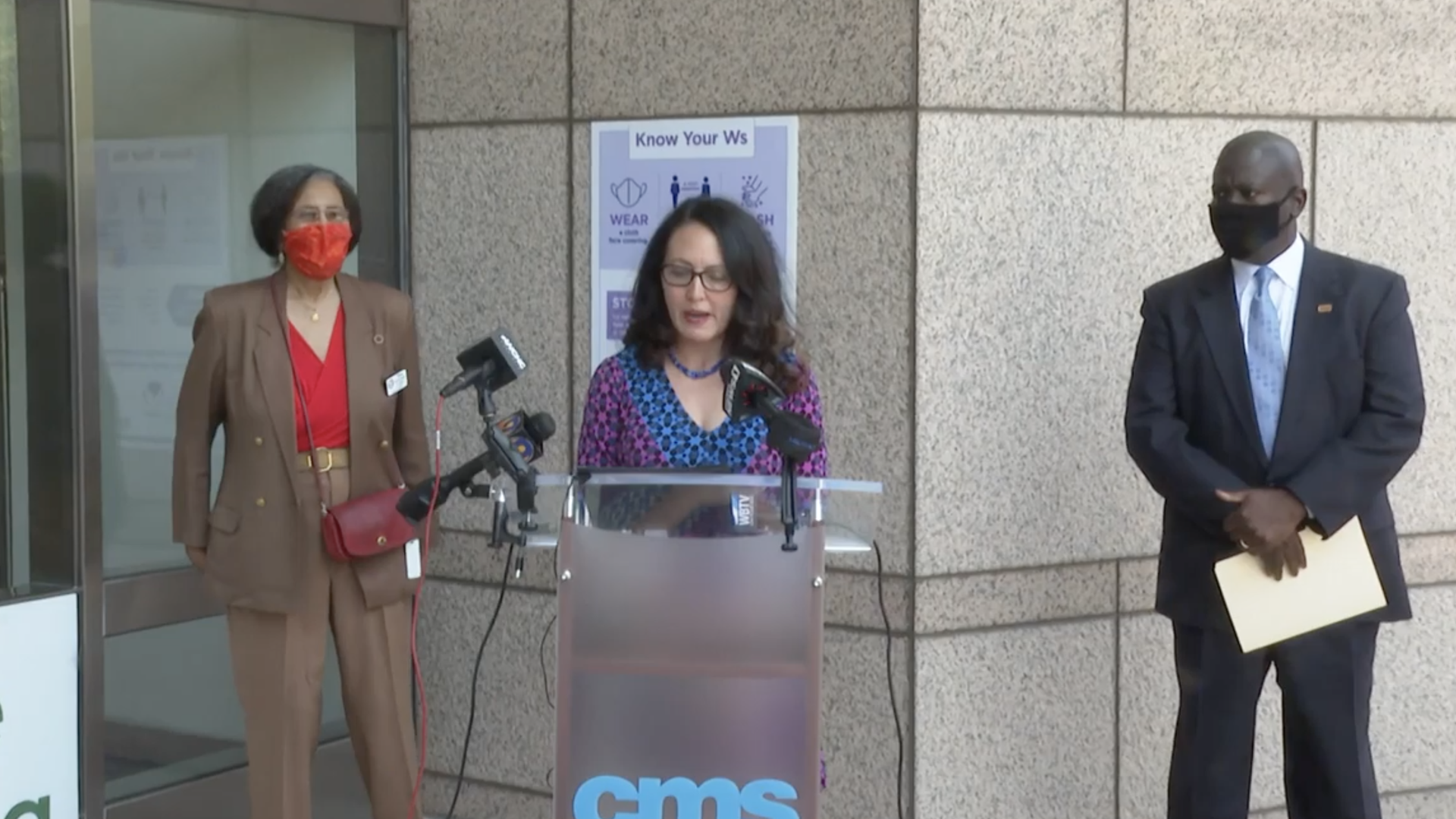 School board chair Elyse Dashew speaks at yesterday's meeting while Earnest Winston looks on