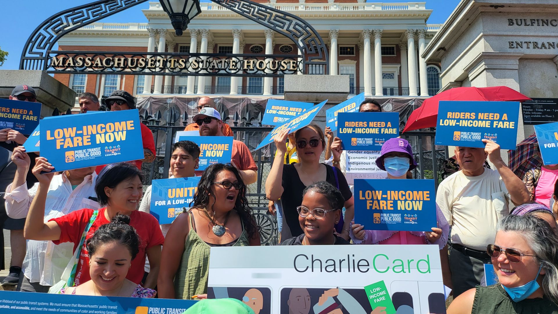 A group of demonstrators outside the Mass. State House asking for MBTA discounts for low-income people.