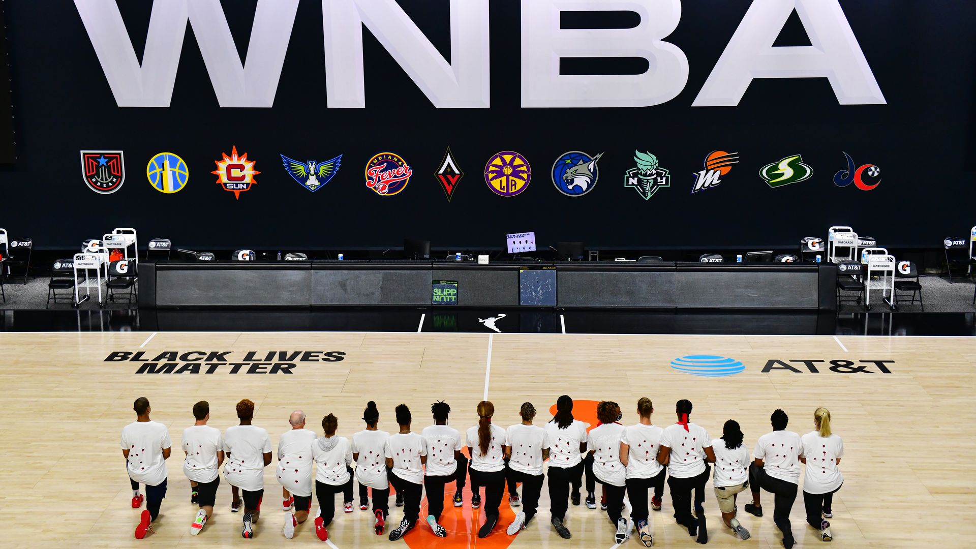The Washington Mystics each wear white T-shirts with seven bullets on the back protesting the shooting of Jacob Blake by Kenosha, Wisconsin police at Feld Entertainment Center on August 26