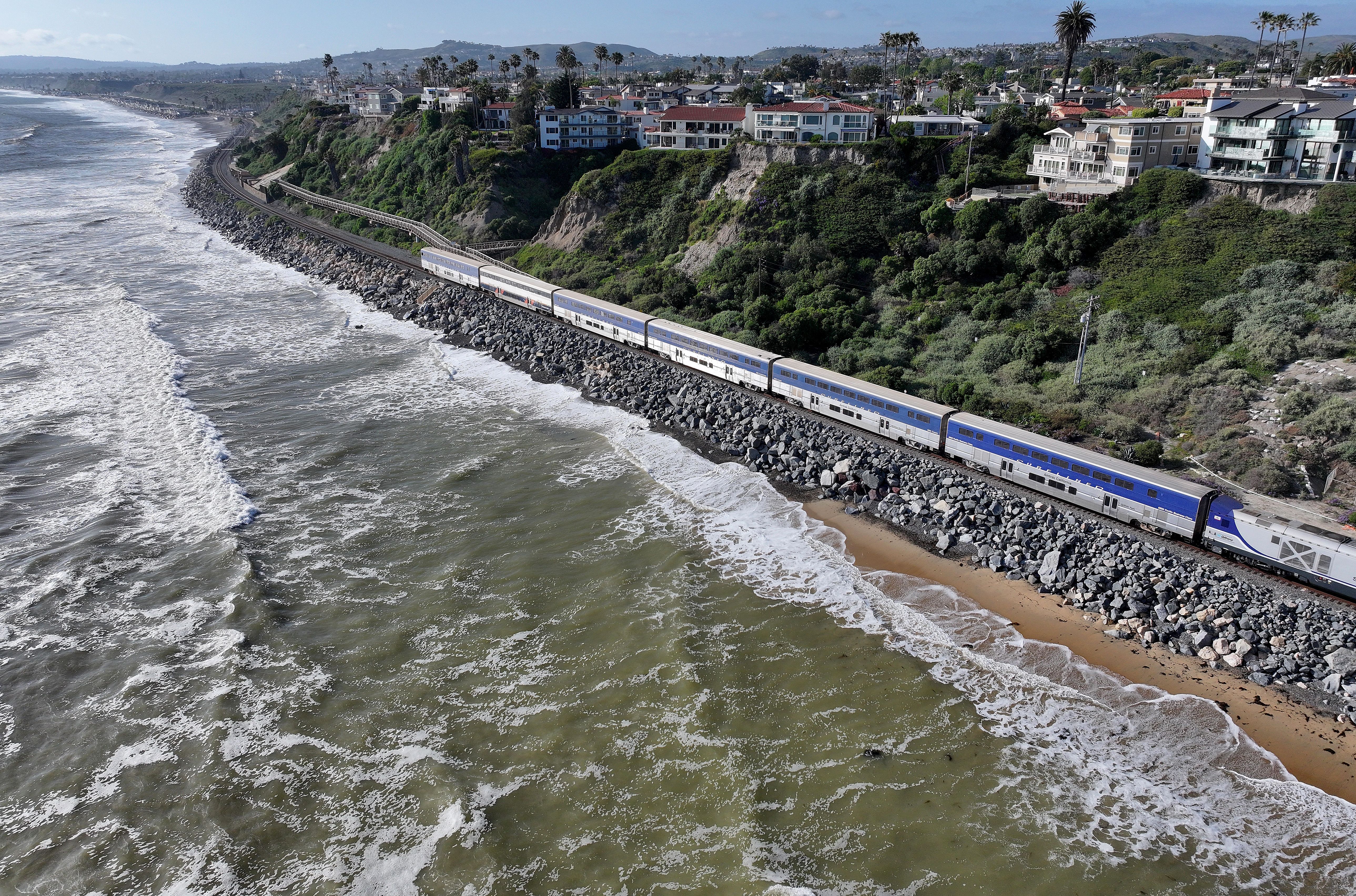 Train tracks by a beach