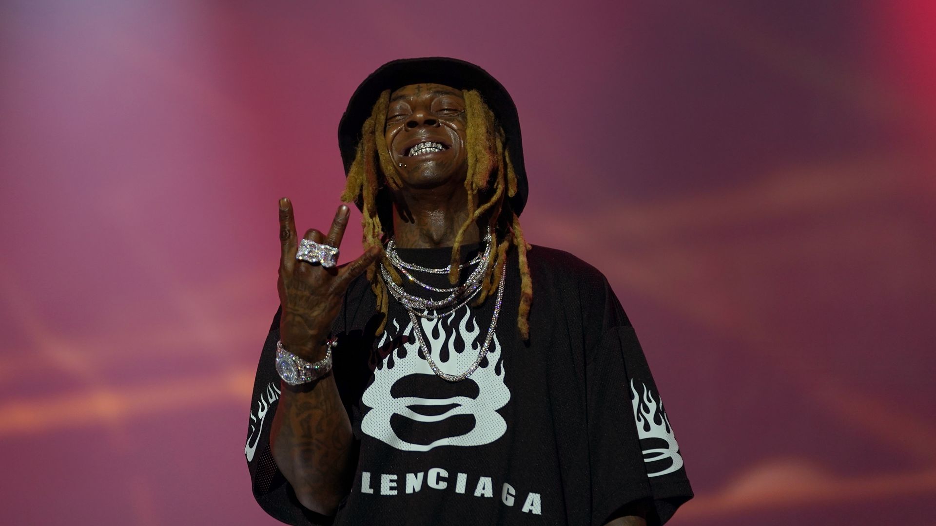 Photo shows Lil Wayne on stage at Essence.